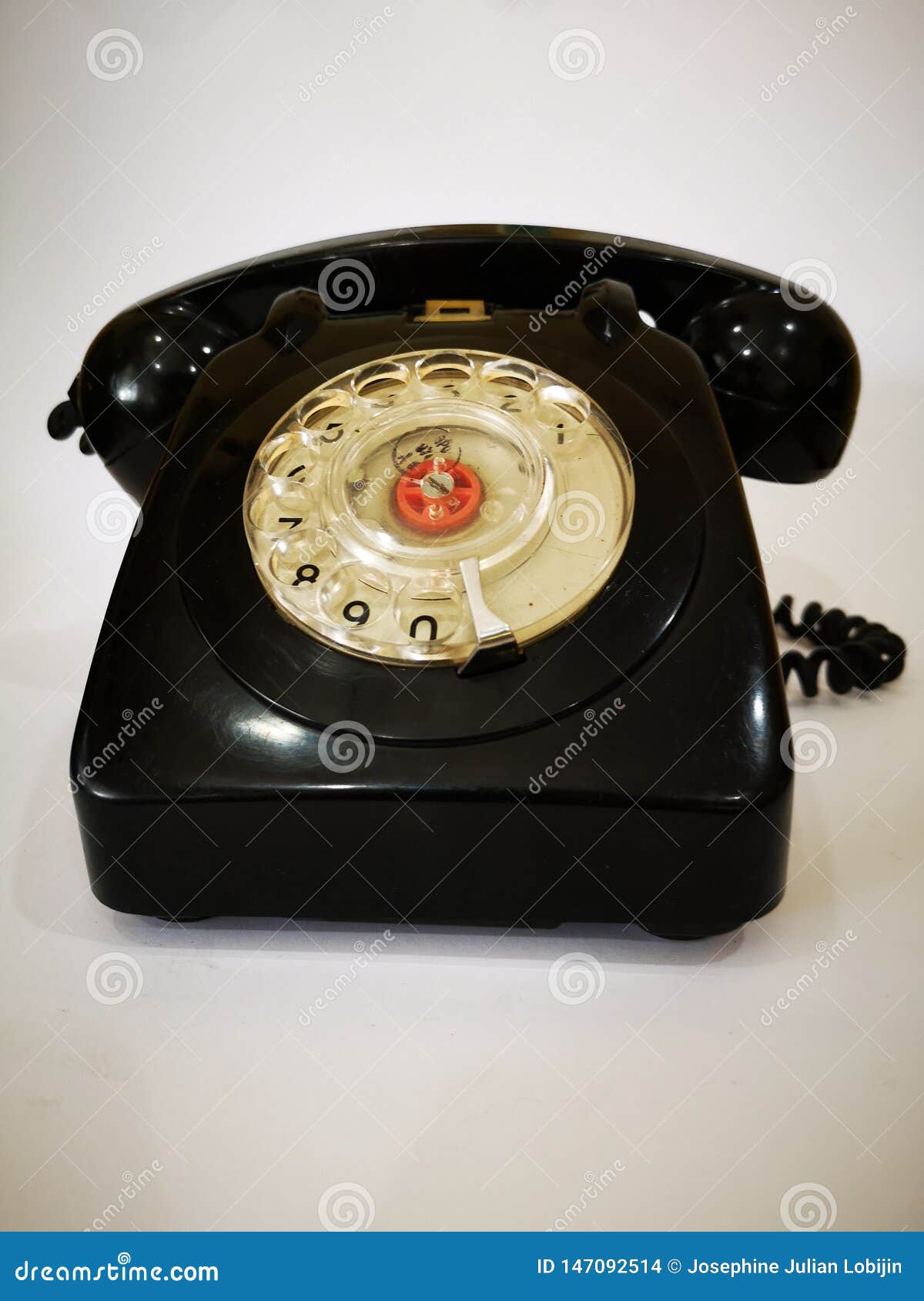 a vintage and antique telephone with white background.