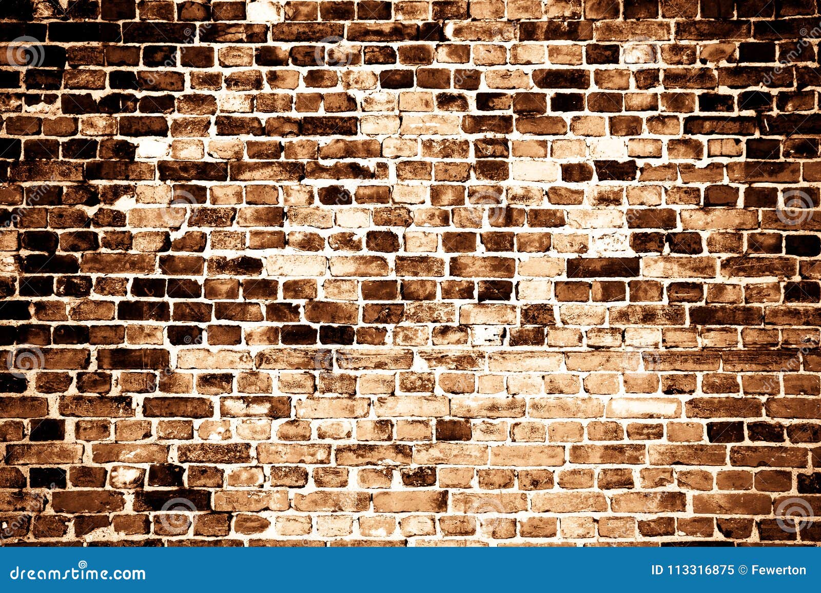 old and weathered grungy red brick wall as texture background in sepia tone with some vignetting