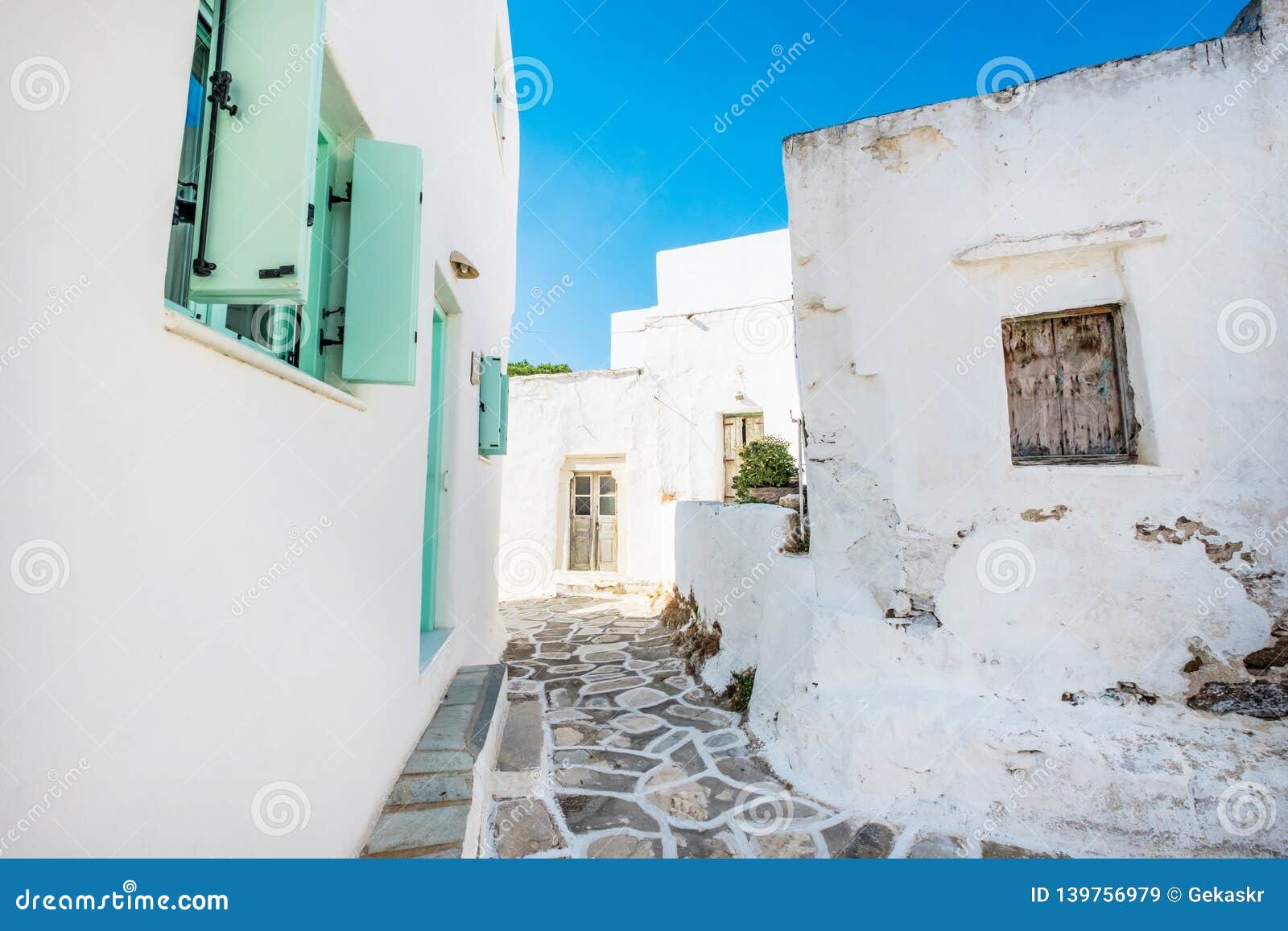 old white houses with turquoise windows in lefkes village