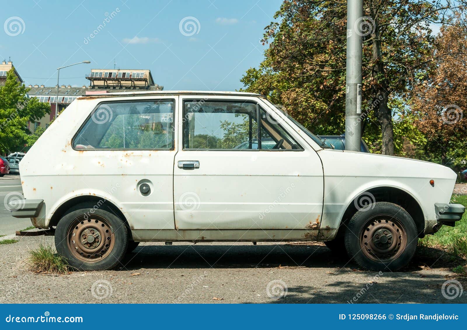 old-white-rusty-yugo-car-made-zastava-kragujevac-parked-street-city-novi-sad-serbia-august-editorial-image-125098266.jpg