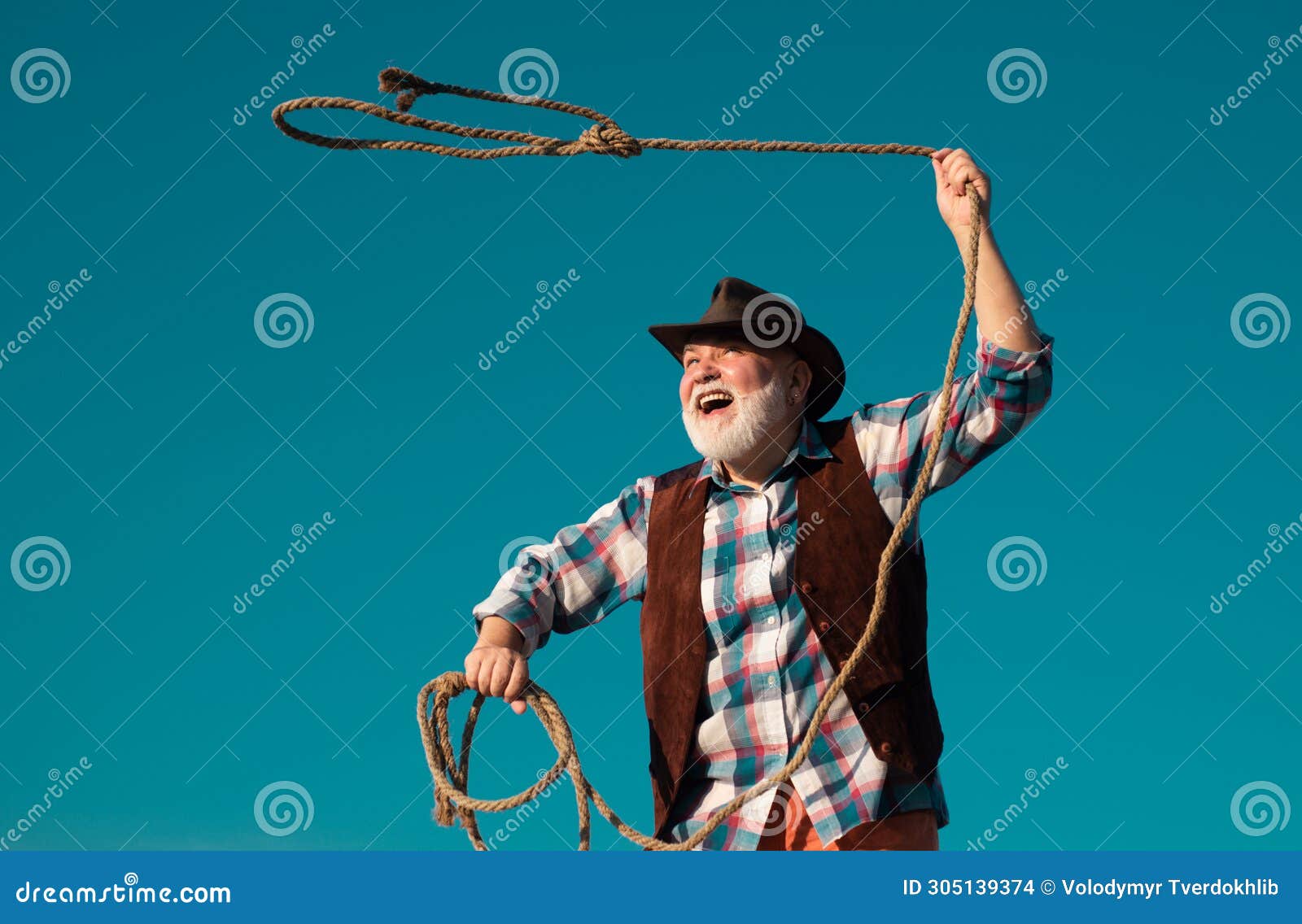 Old Wild West Cowboy with Rope. Bearded Western Man Throwing Lasso