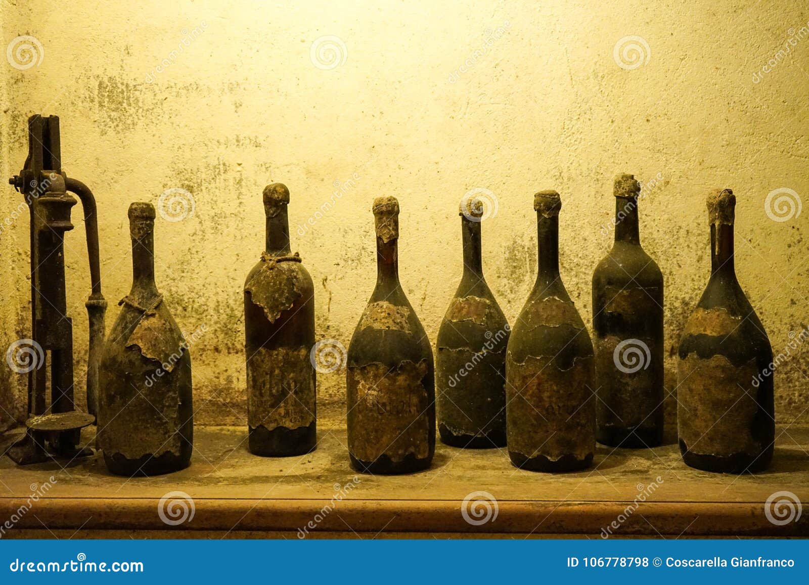 Old bottles of dusty wine stock photo. Image of cellar 106778798