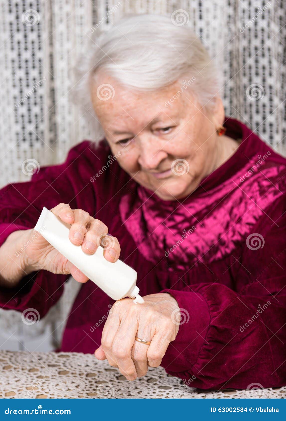 Old Woman Applying Hand Cream Stock Photo Image of treatment, squeeze 63002584
