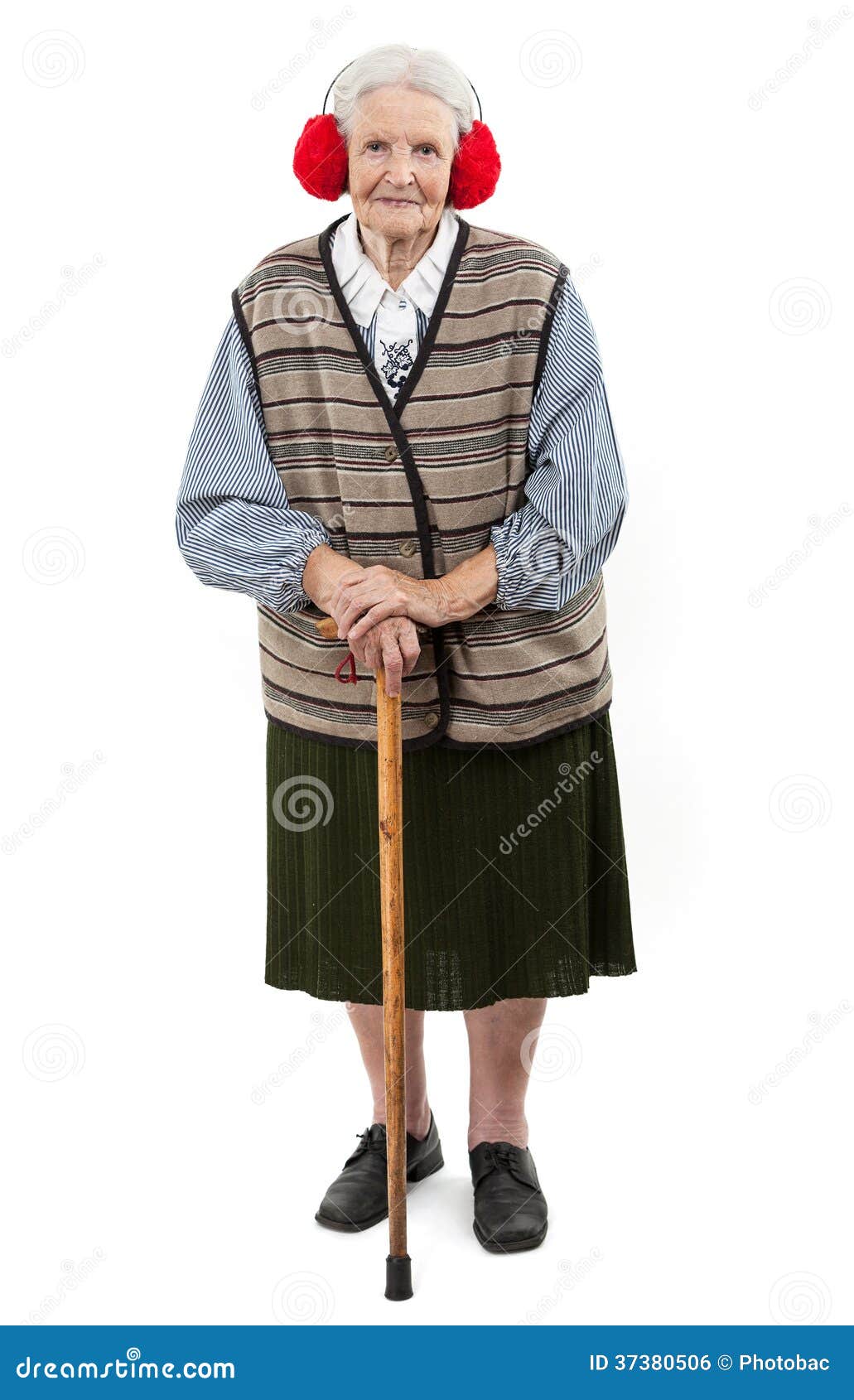 old woman with a cane wearing faux fur ear muffs