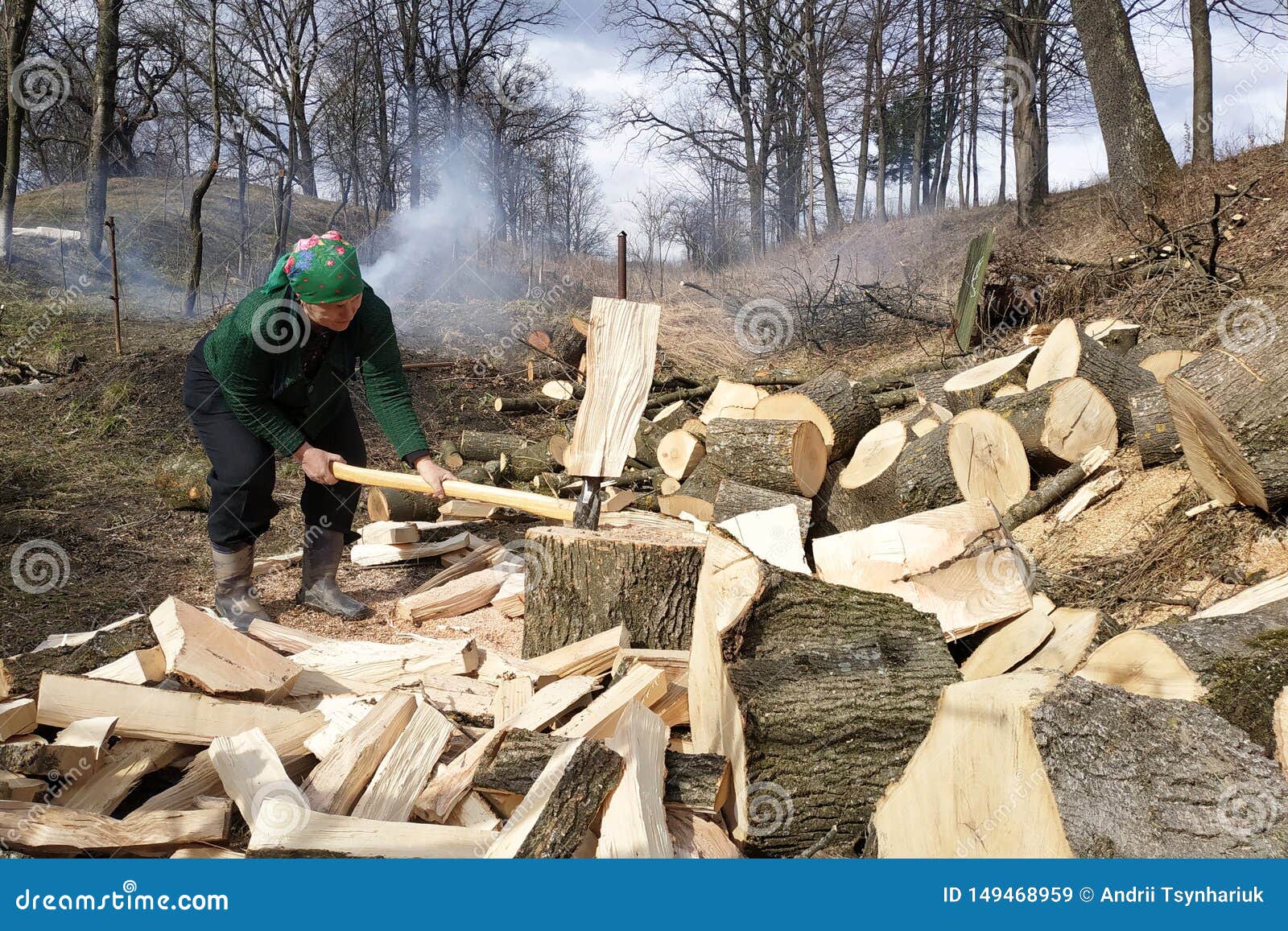 After Ten Years Of Chopping Firewood An Old Woman Chopping Firewood for the Winter, Also Removes Her Yard