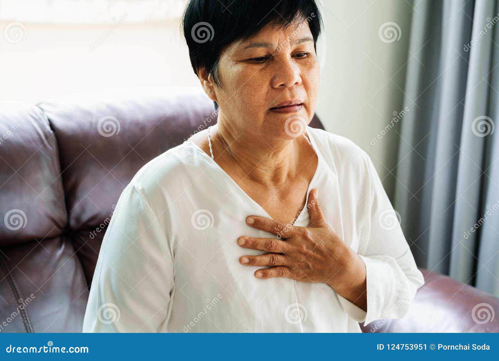 Old Woman Having Heart Attack And Grabbing Her Chest Stoc