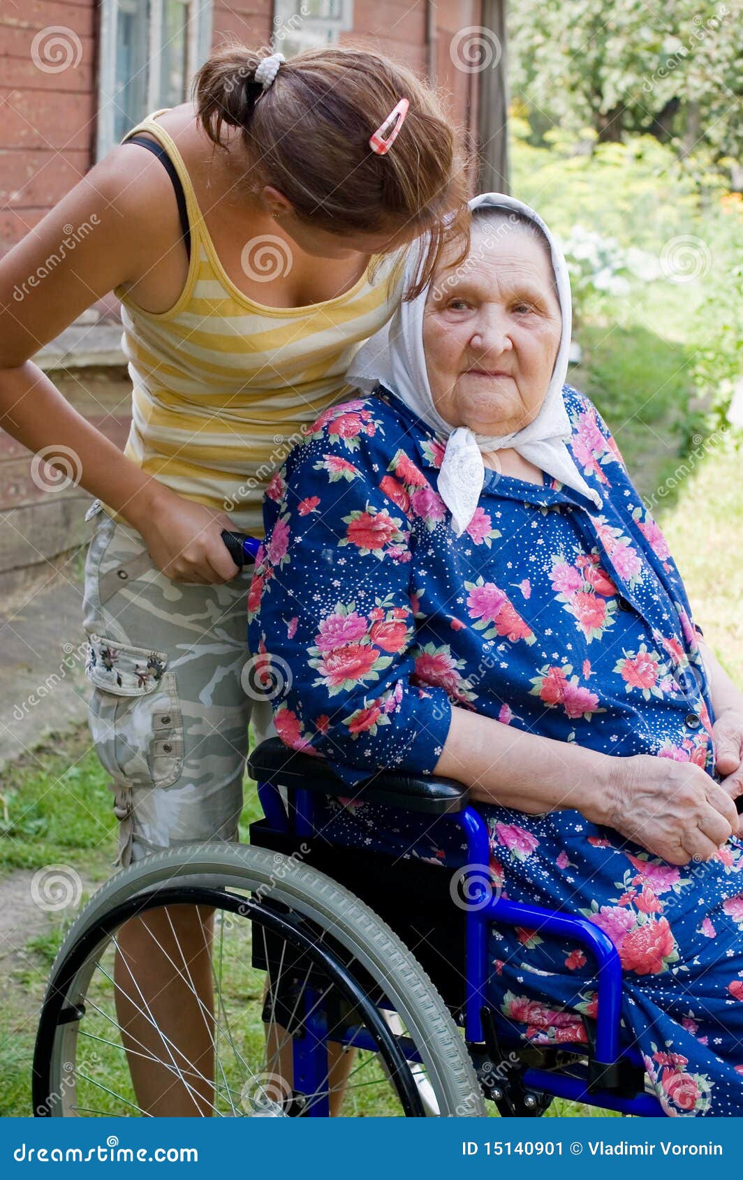 old woman in an invalid armchair