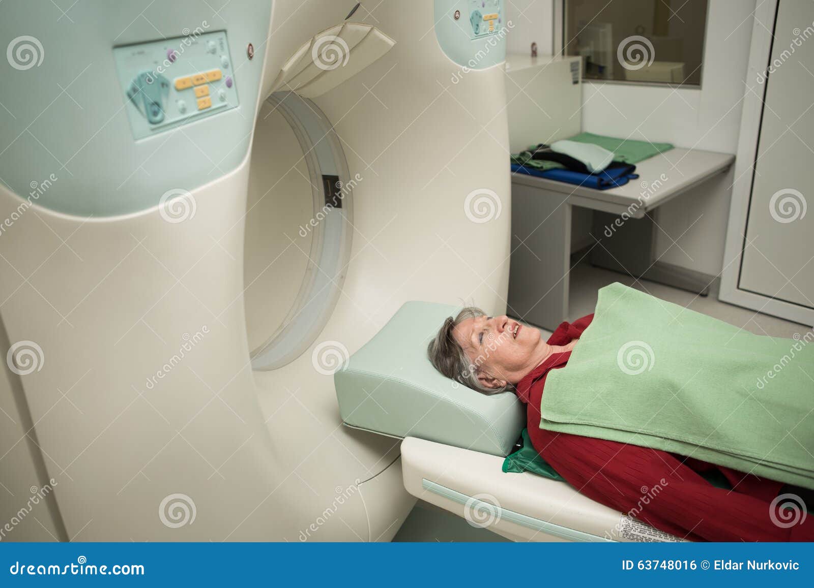 old woman patient at computerized axial tomography (cat) scan.examining cancer patient with ct.tumor detection