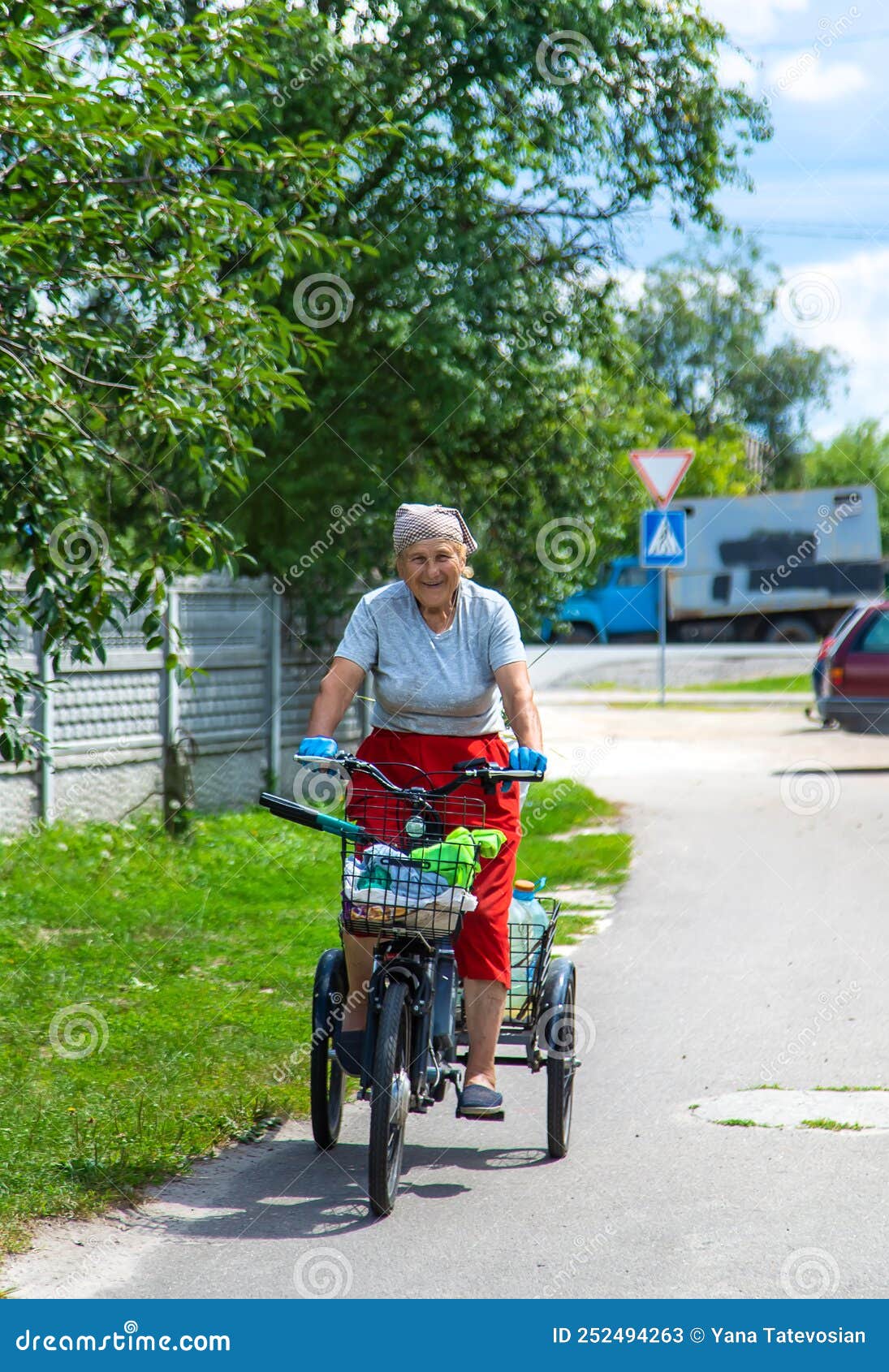 An Old Woman Rides A Bicycle Selection Focus Stock Image Image Of