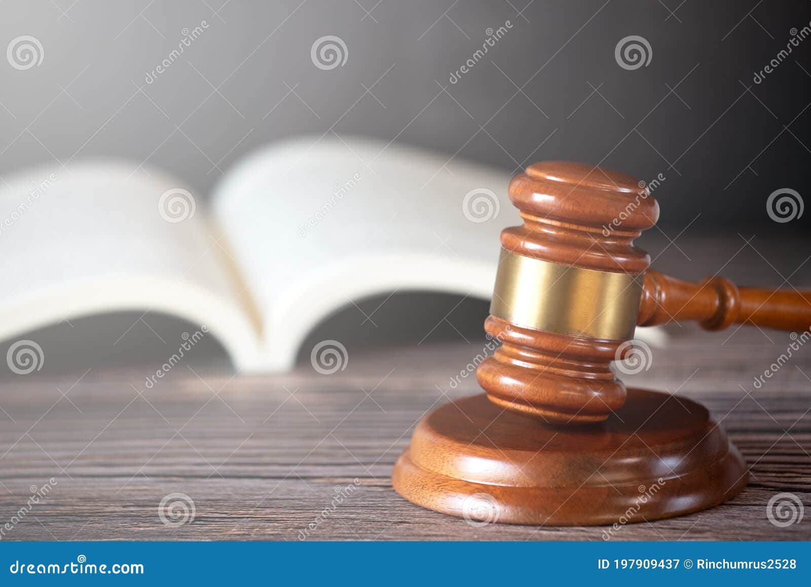 old wood judge hammer with law book on the table wood background, used for adjudication and justice