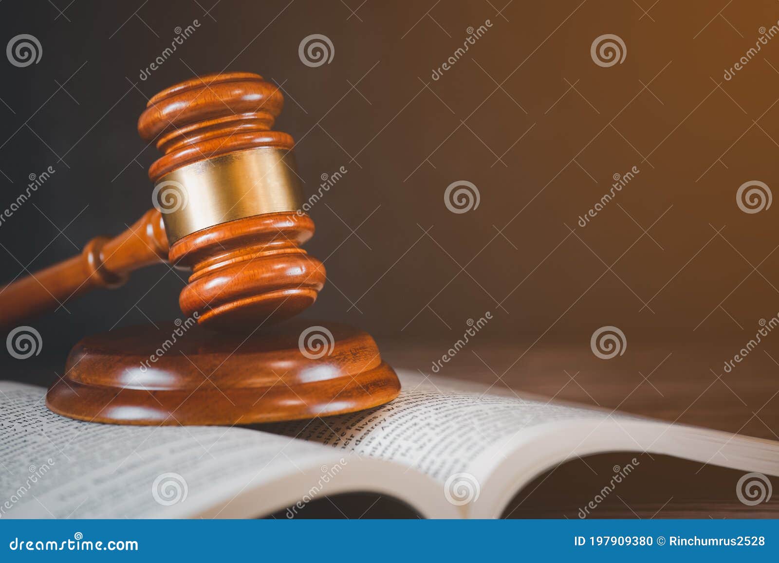 old wood judge hammer with law book on the table wood background, used for adjudication and justice