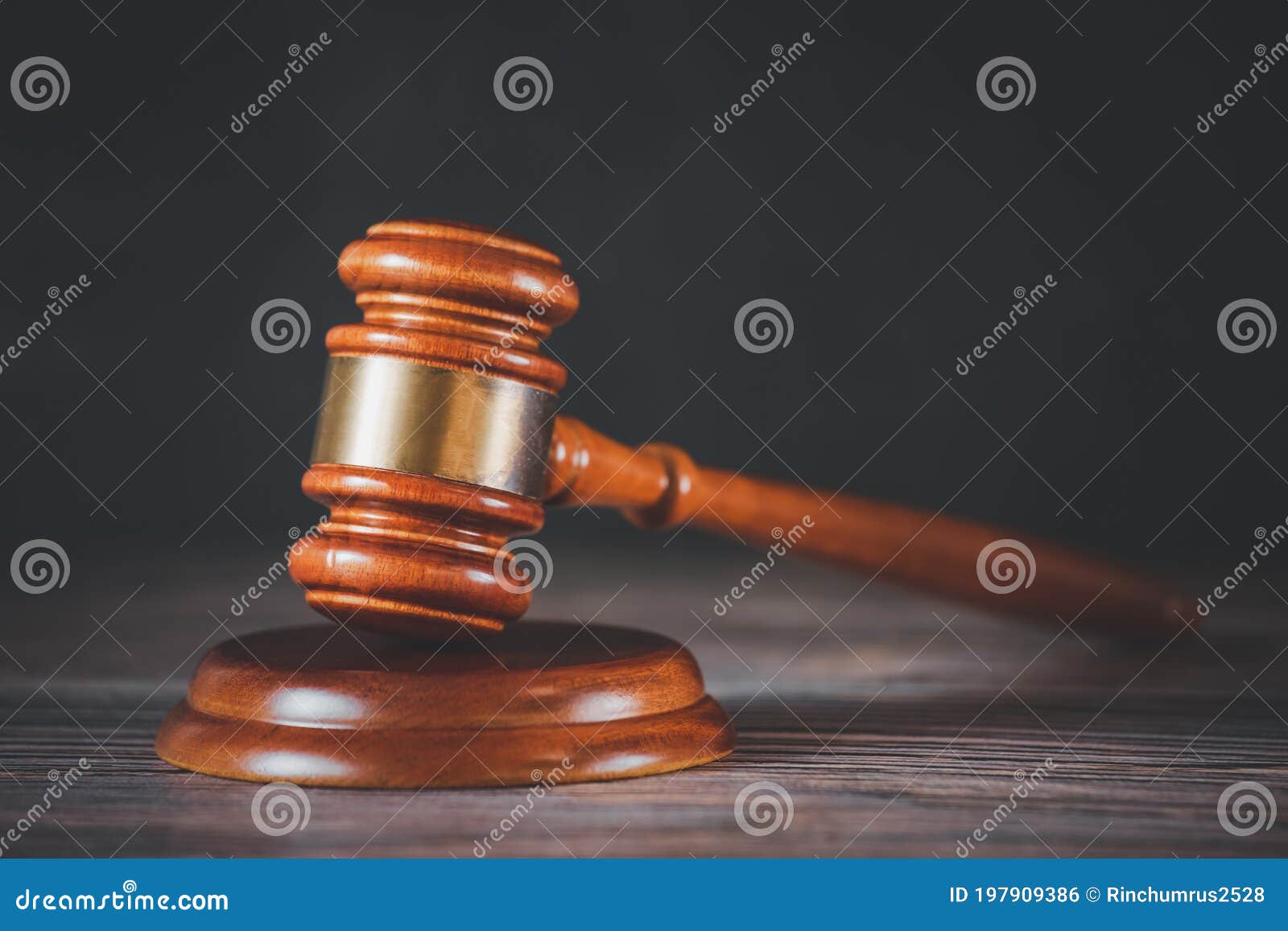 old wood judge hammer with law book on the table wood background, used for adjudication and justice