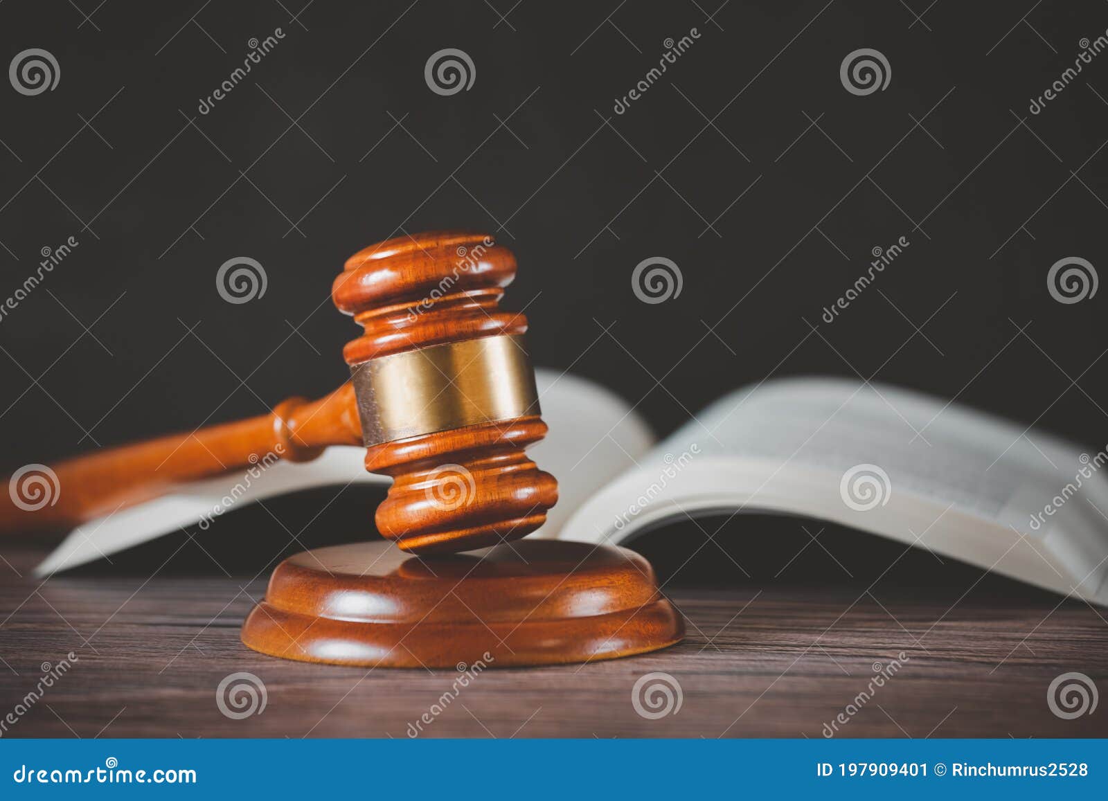 old wood judge hammer with law book on the table wood background, used for adjudication and justice