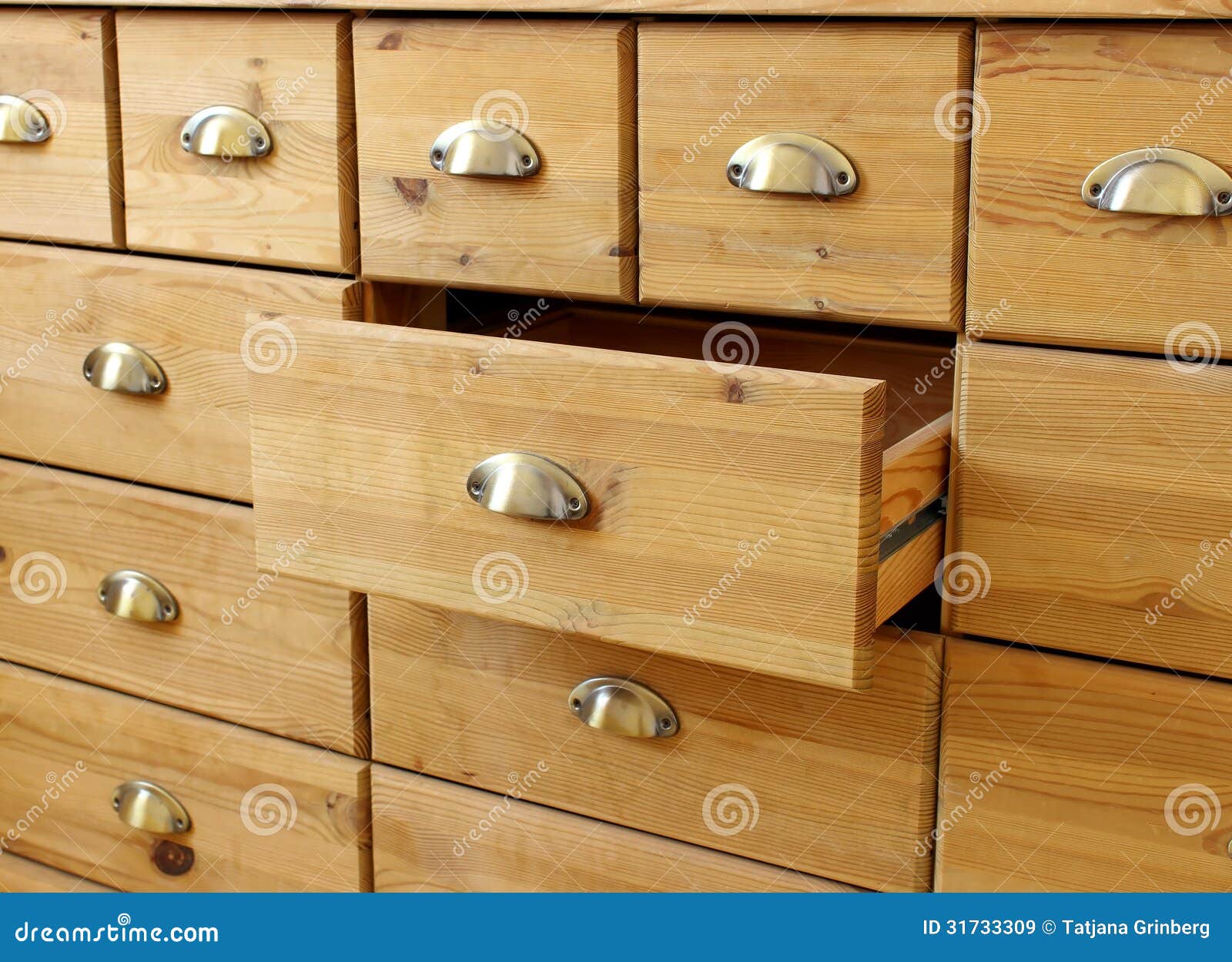 Stock Images: Old wooden antique chest of drawers with metal handles