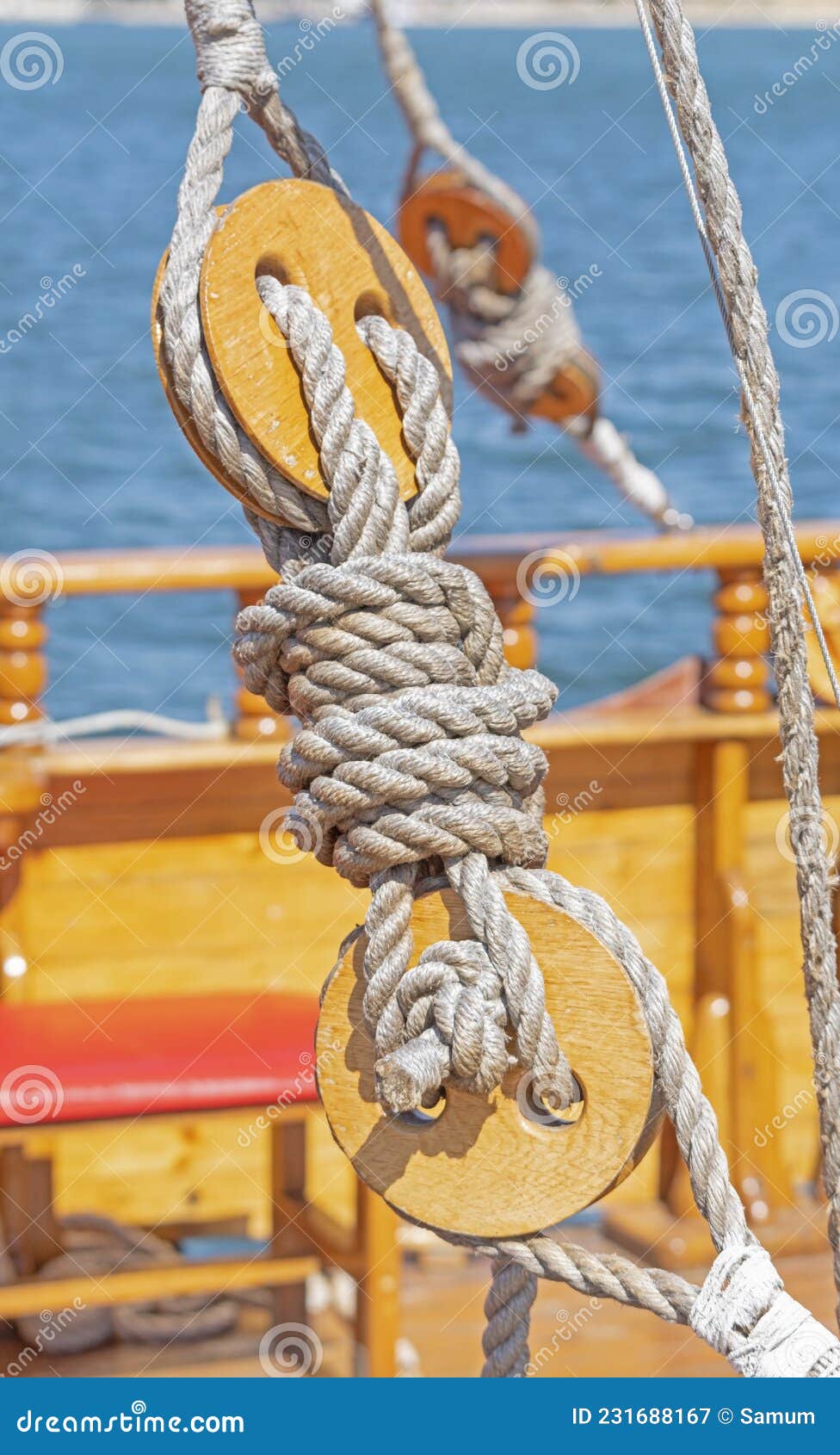 Old wooden block with rope stock image. Image of macro 231688167