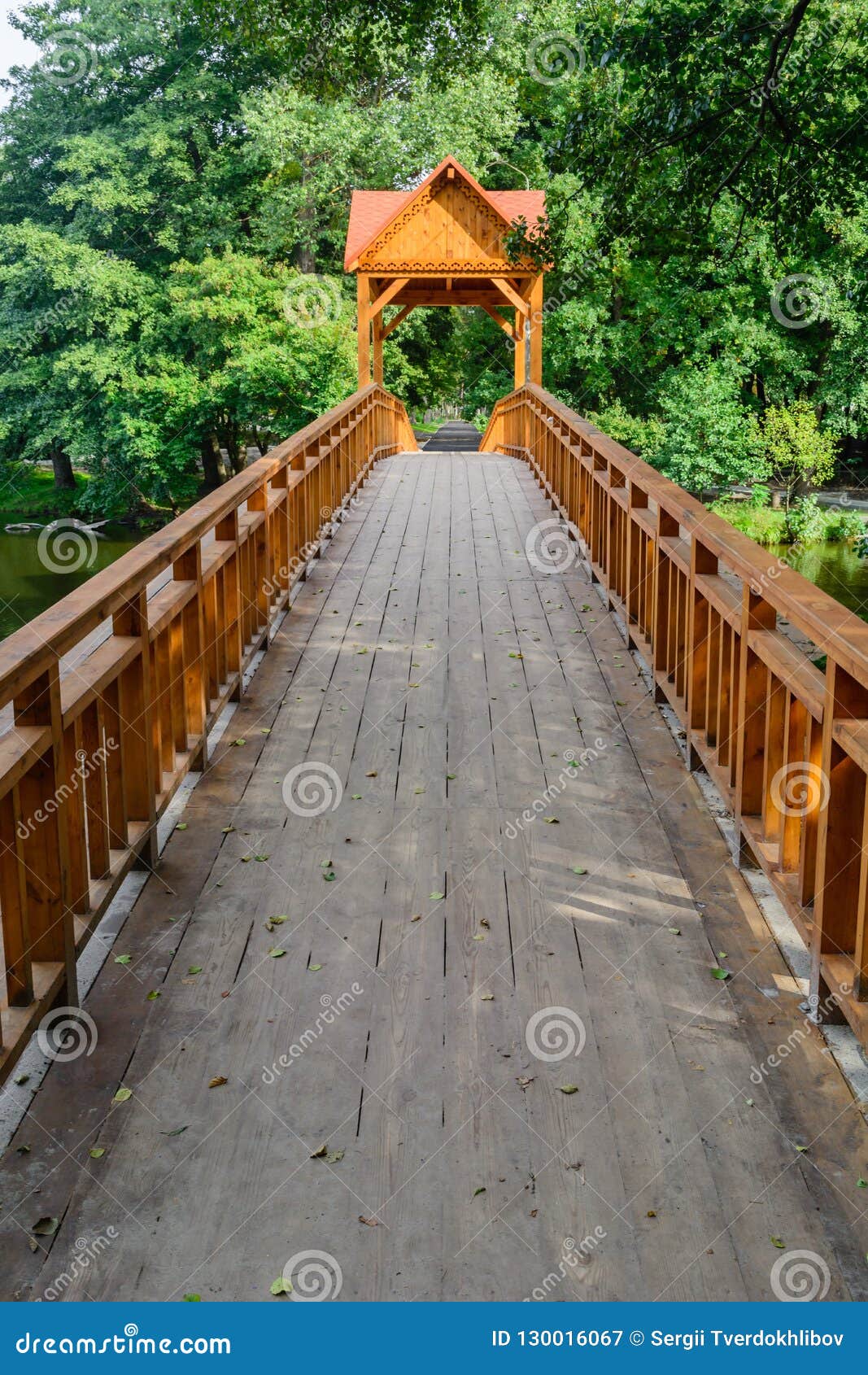 Old Wooden Bridge Over the River with Arbor. Forest River. Stock Image