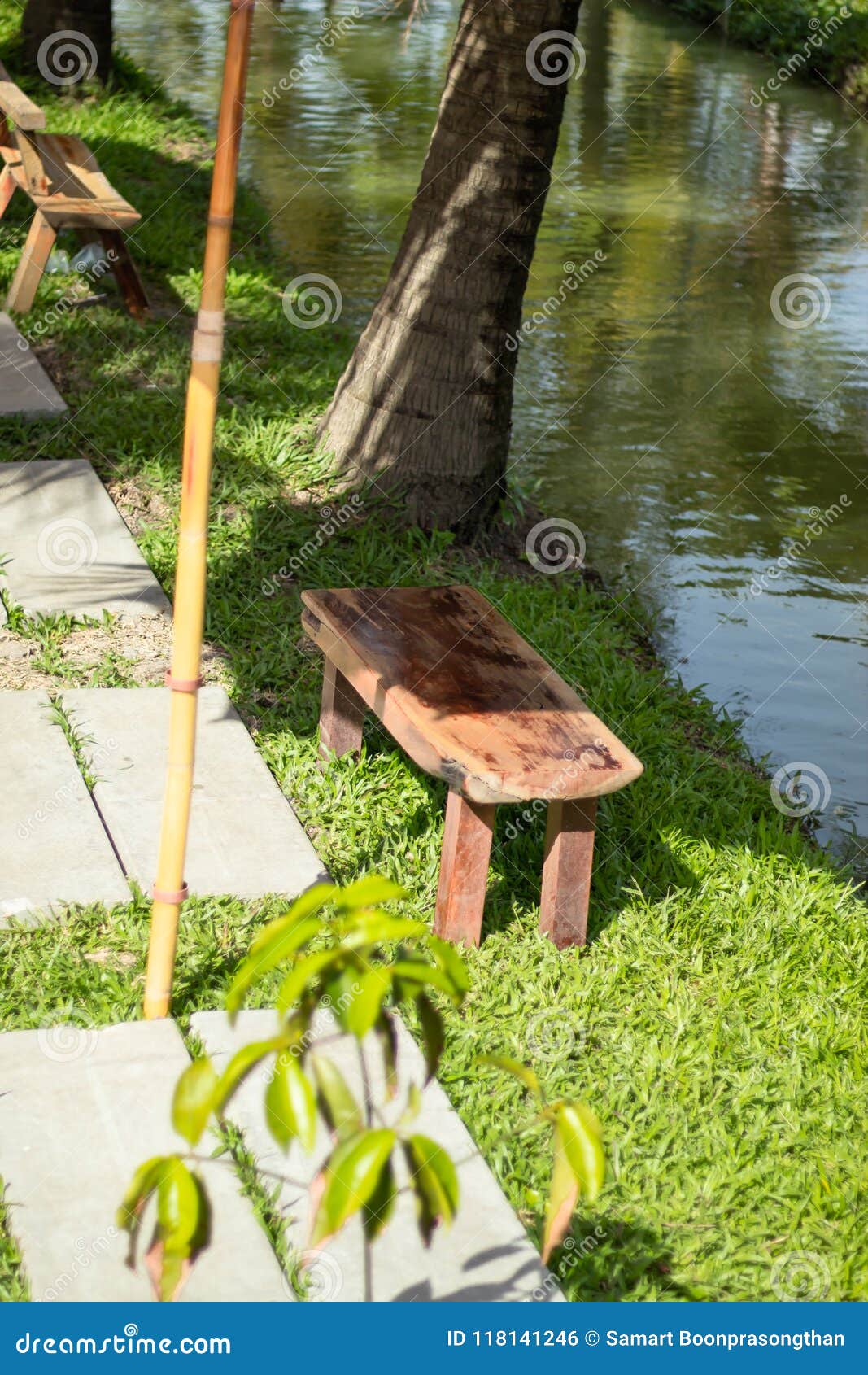 Old Wooden Chairs And Cement Block Floor A Walk Stock Photo