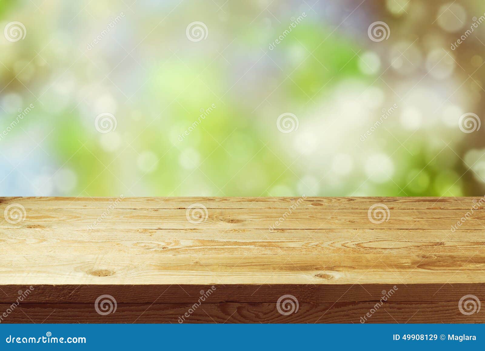 old wooden deck table with spring bokeh background. ready for product display montage.