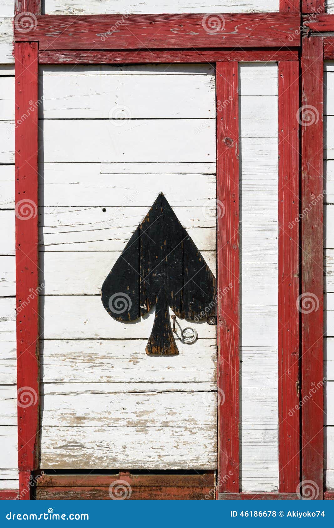 Old wooden door with play card pattern