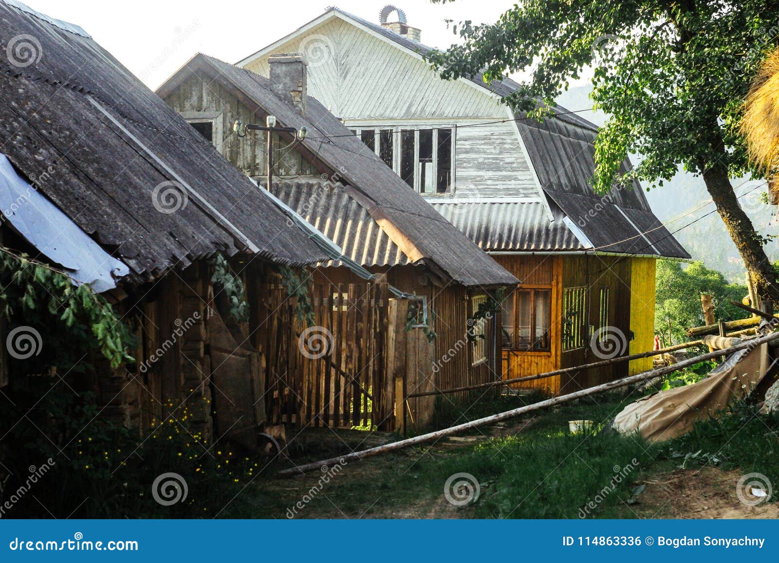 Old Wooden House with Fire Wood on Top of Hill Mountains in Sun Stock ...