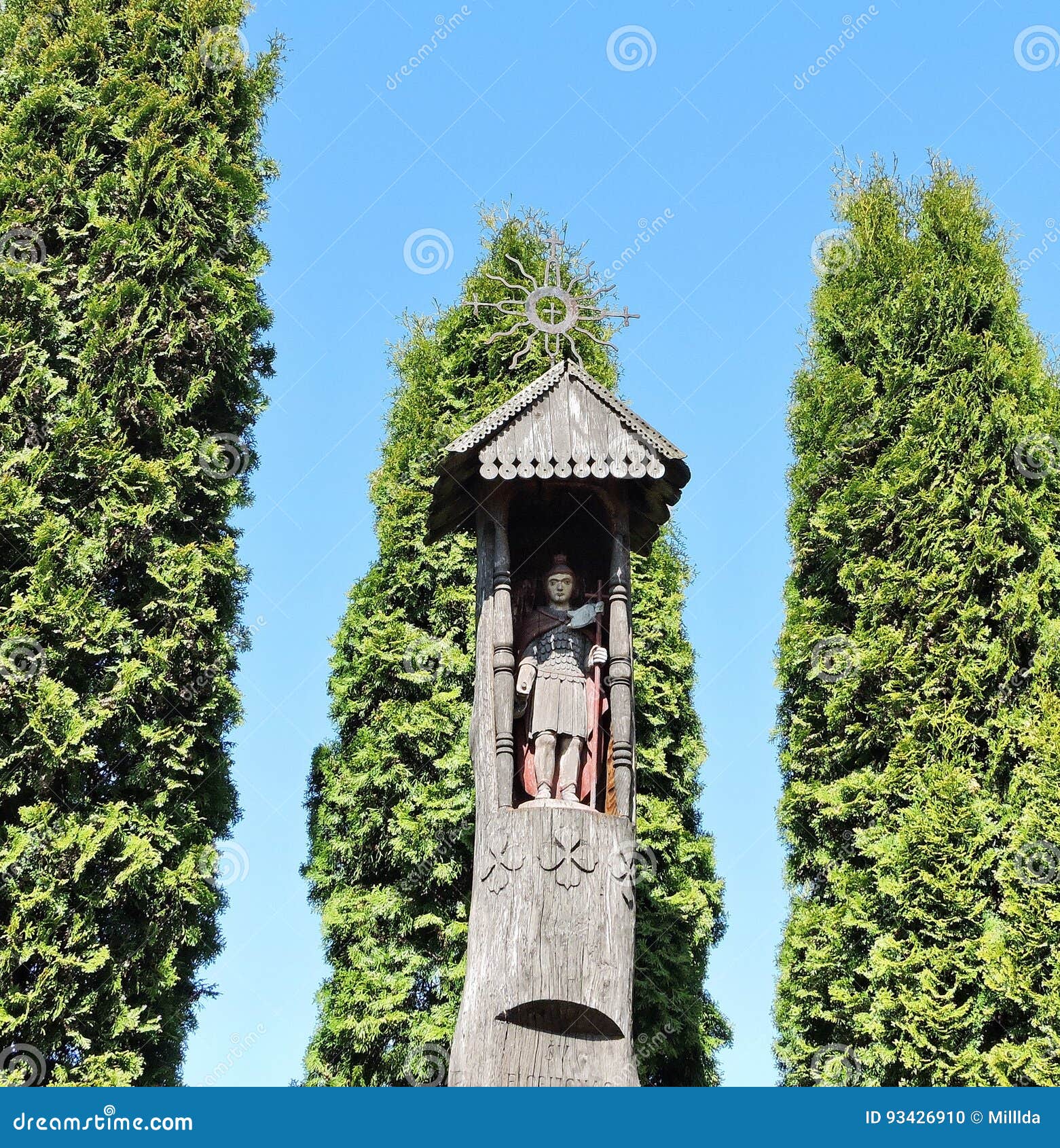 old wooden statue in churchyard, lithuania