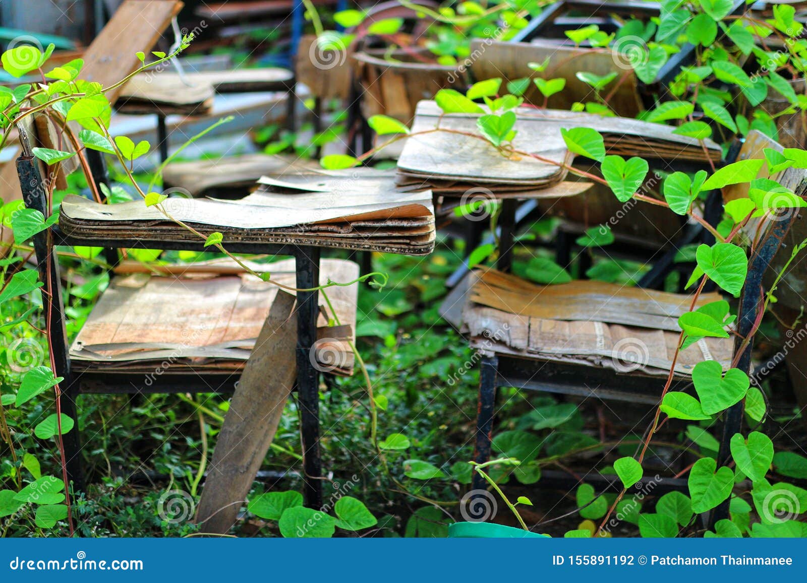 The Old Wooden Student Desk Is Worn Out And Placed Outdoors There