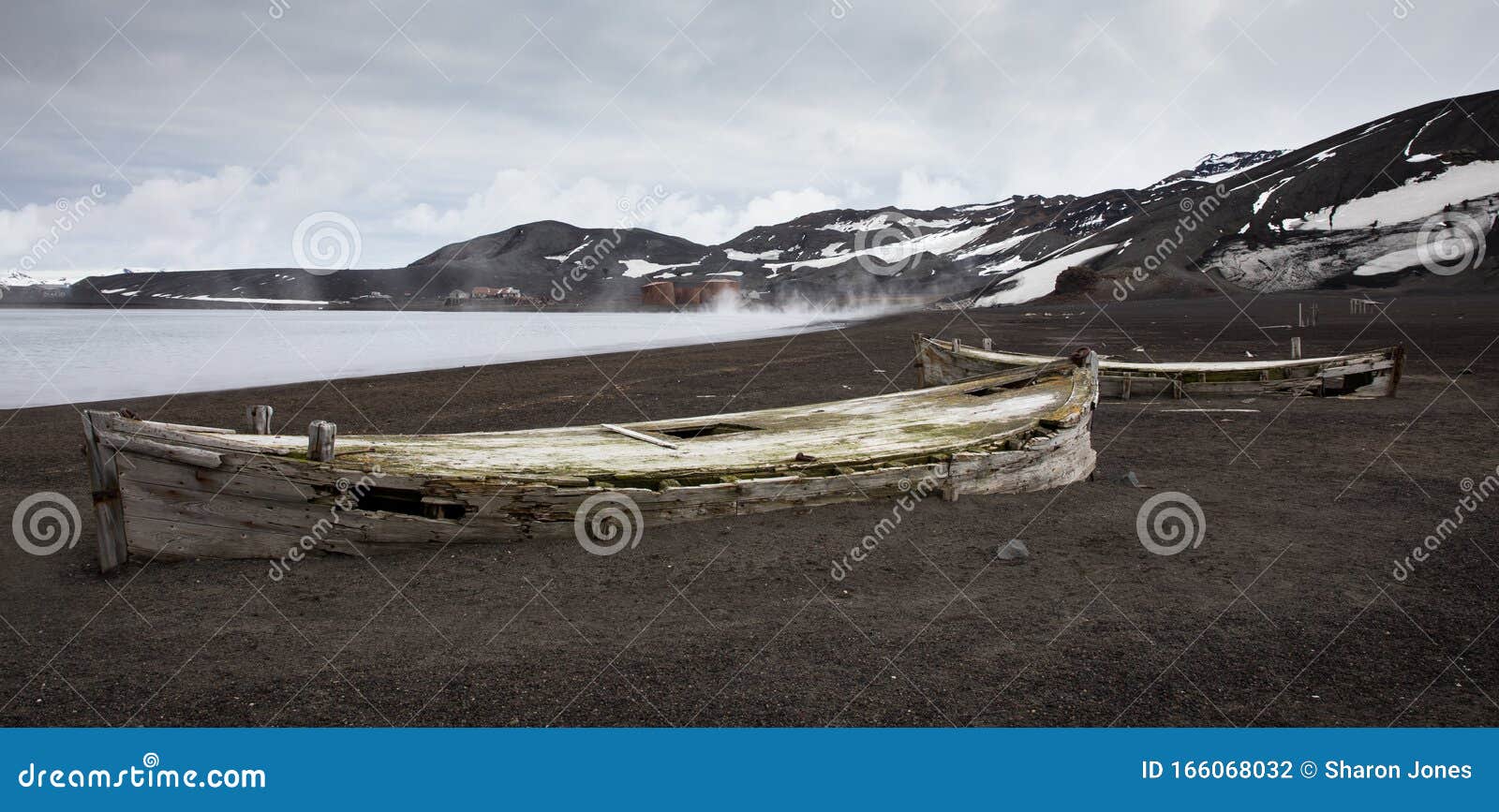old wooden whaling boats on the beach at whaler`s bay, antarctica