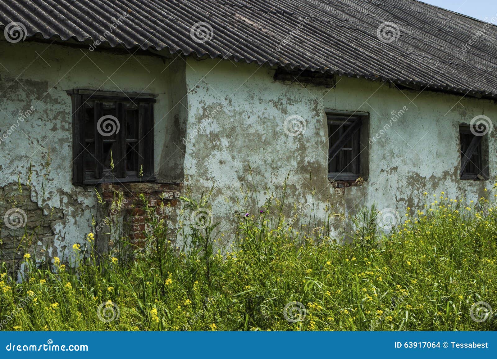 old wooden window in a brick abandoned house