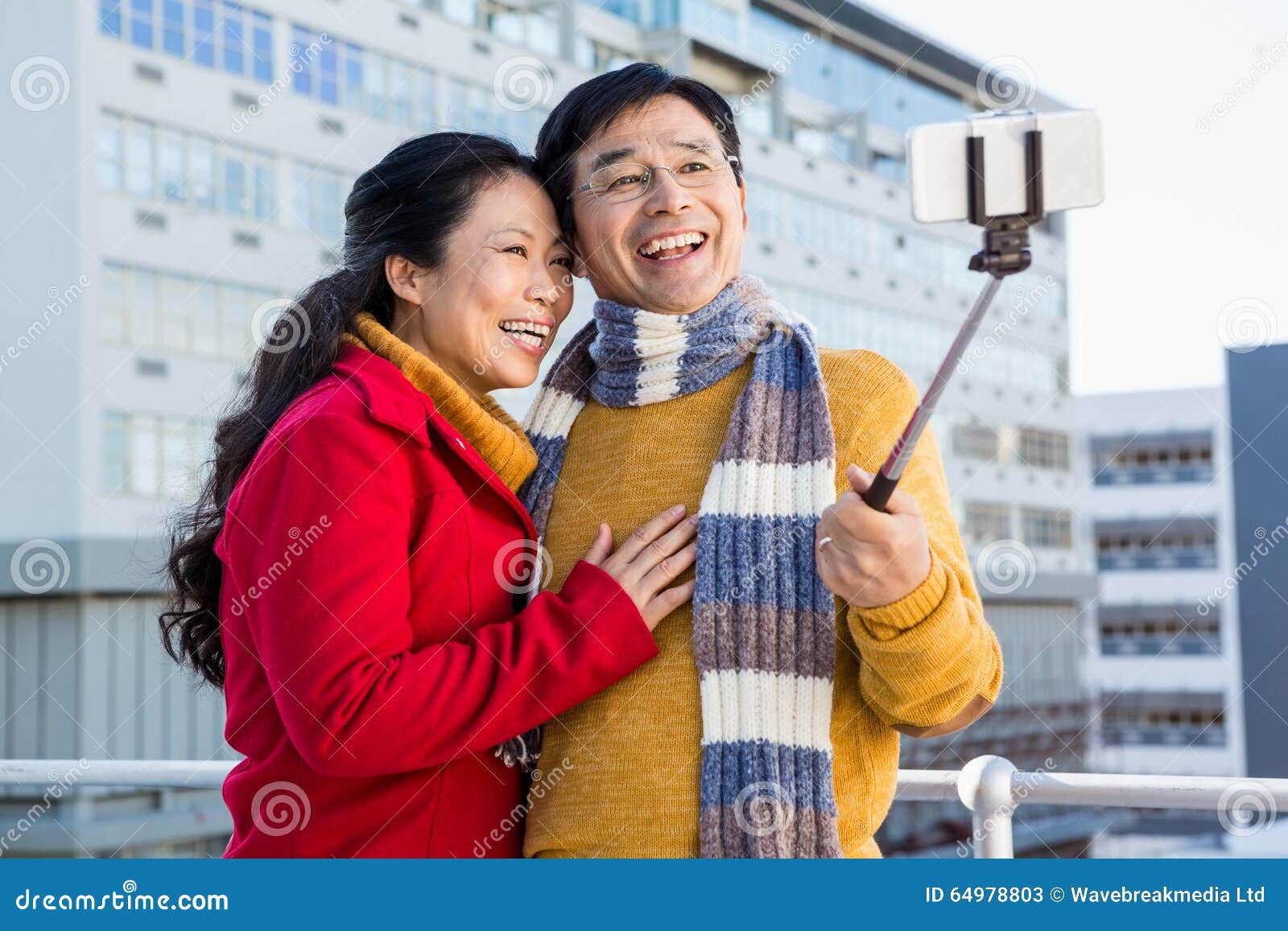 Older Asian Couple On Balcony Taking Selfie Stock Image Image Of Smiling Adult 64978803