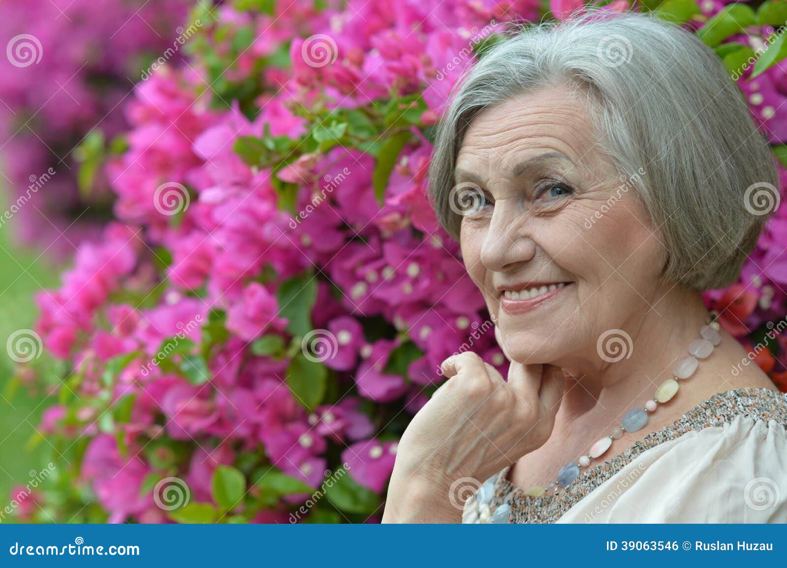 Older woman with flowers stock photo. Image of adult 39063546