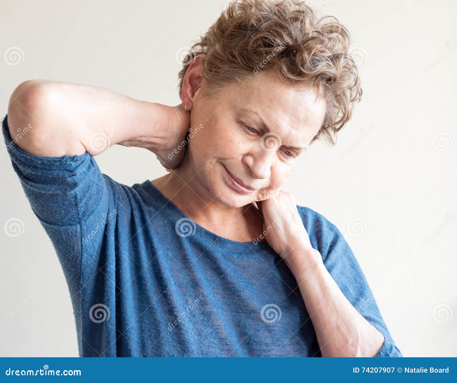 Older woman rubbing neck stock image. Image of neck, blue 74207907