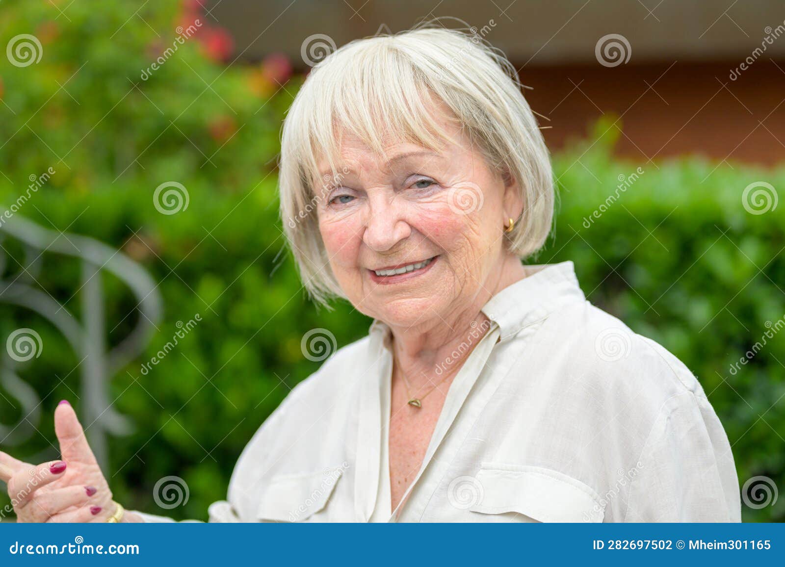 Older Woman with White Hair Pointing To the Side Stock Photo Image of