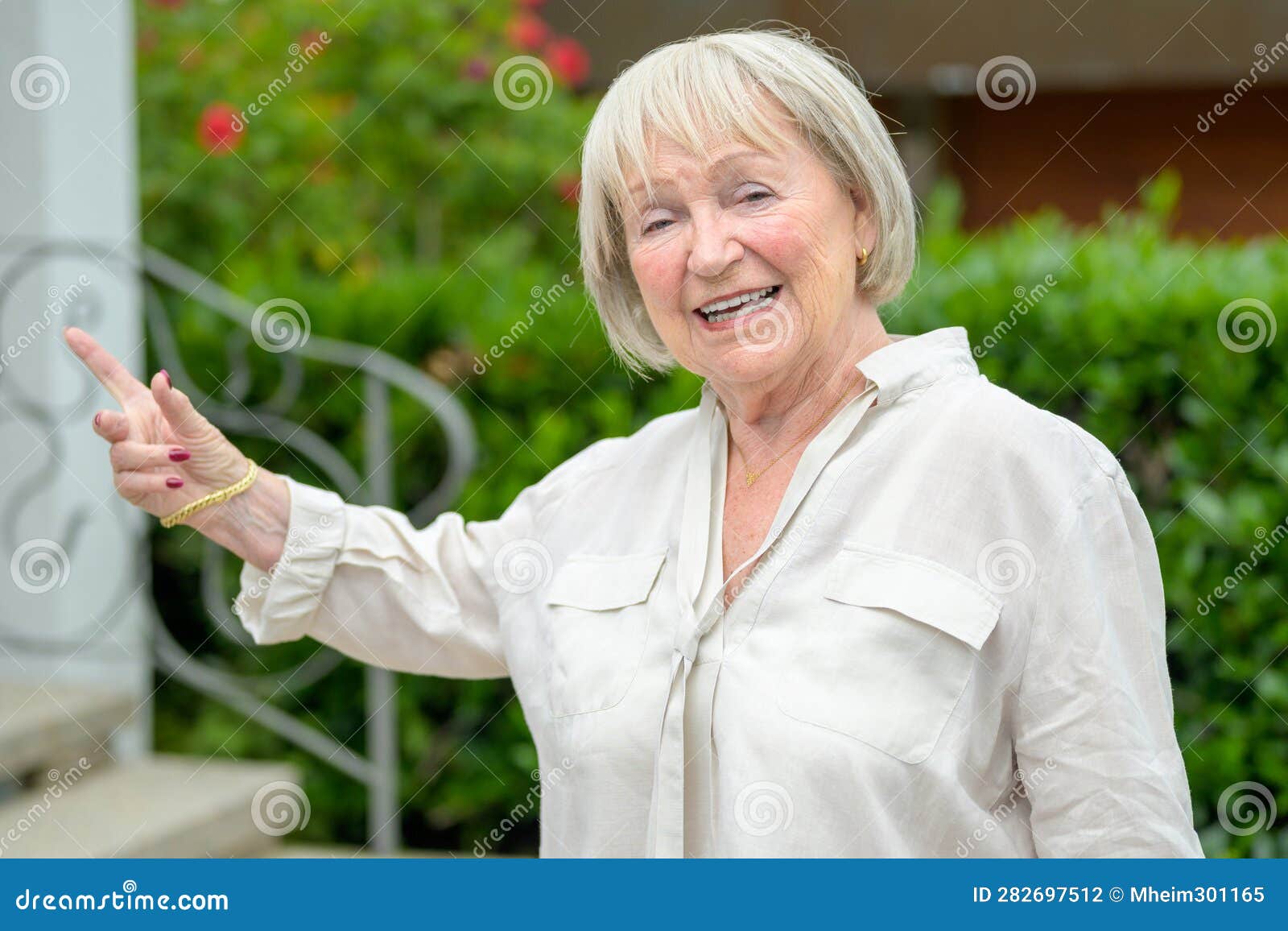 Older Woman with White Hair Pointing To the Side Stock Photo Image of