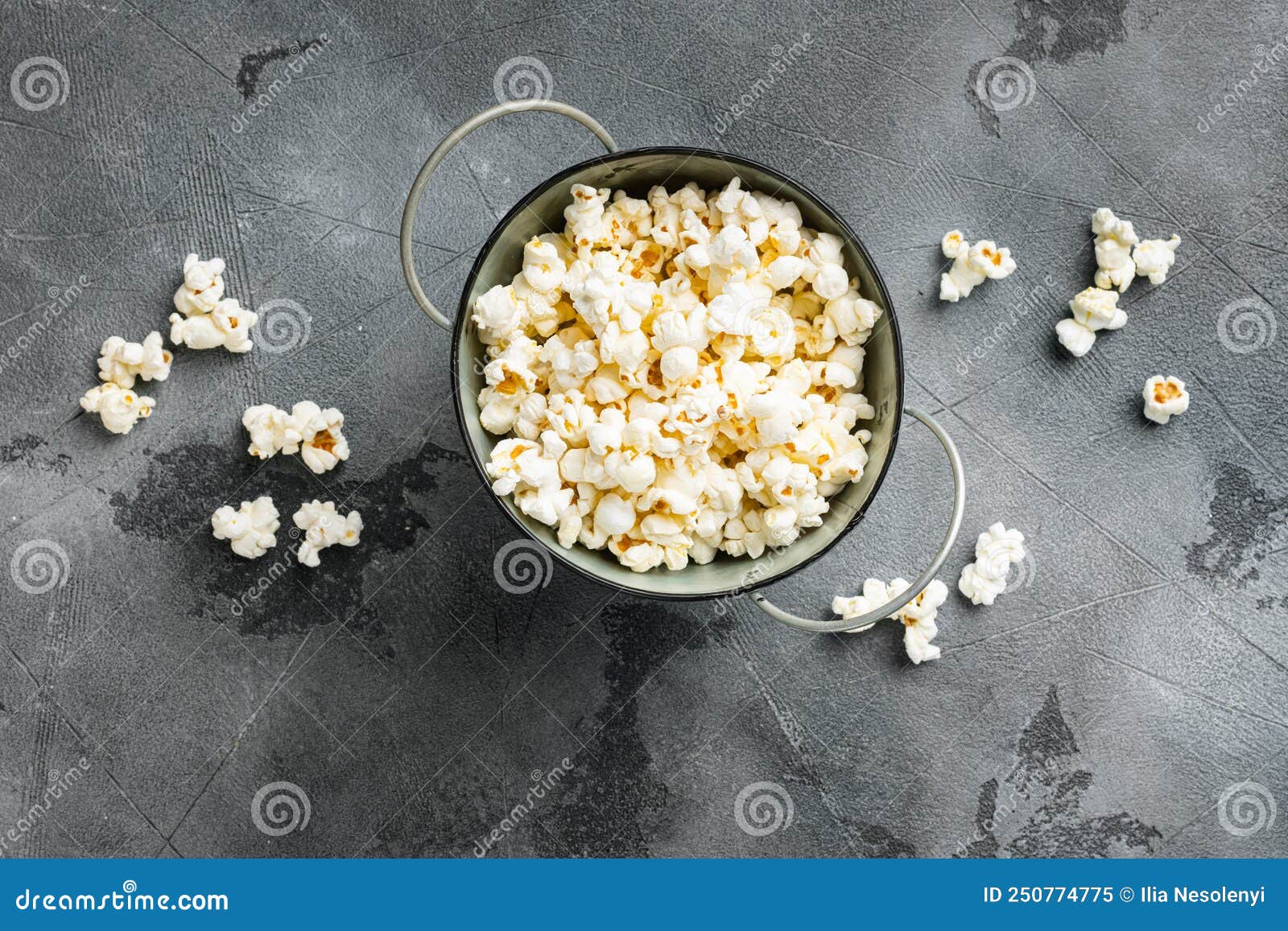 Olive Oil Popped Popcorn on Gray Stone Table Background, Top View Flat