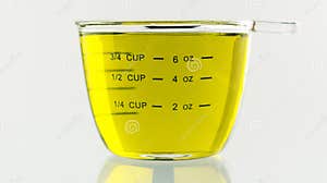Olive Oil Poured Into 250 Ml Measuring Cup Stock Image Image Of 