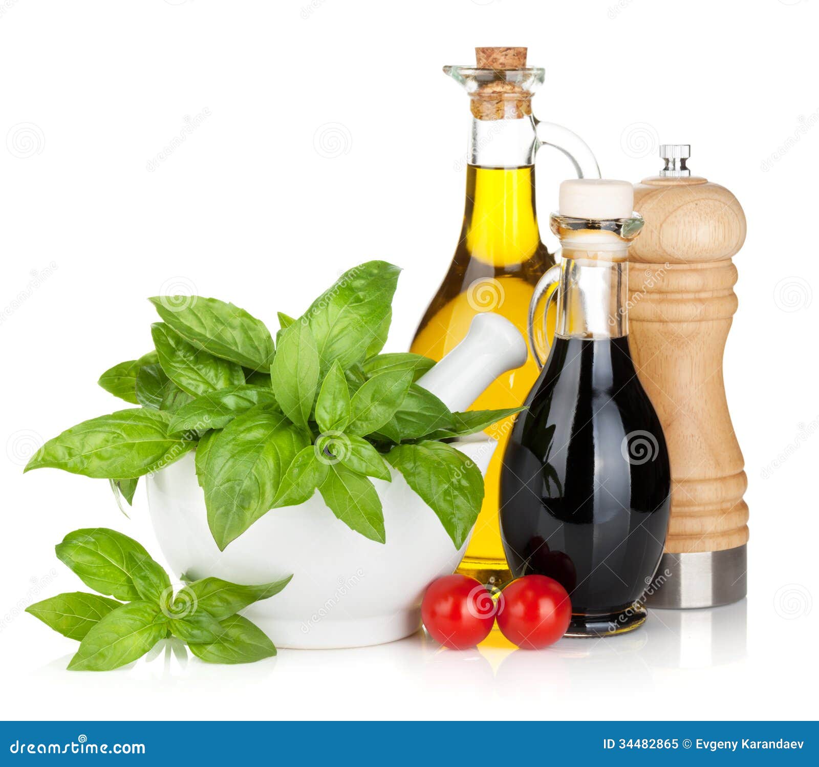 Olive Oil and Vinegar Bottles with Basil and Tomatoes Stock Image