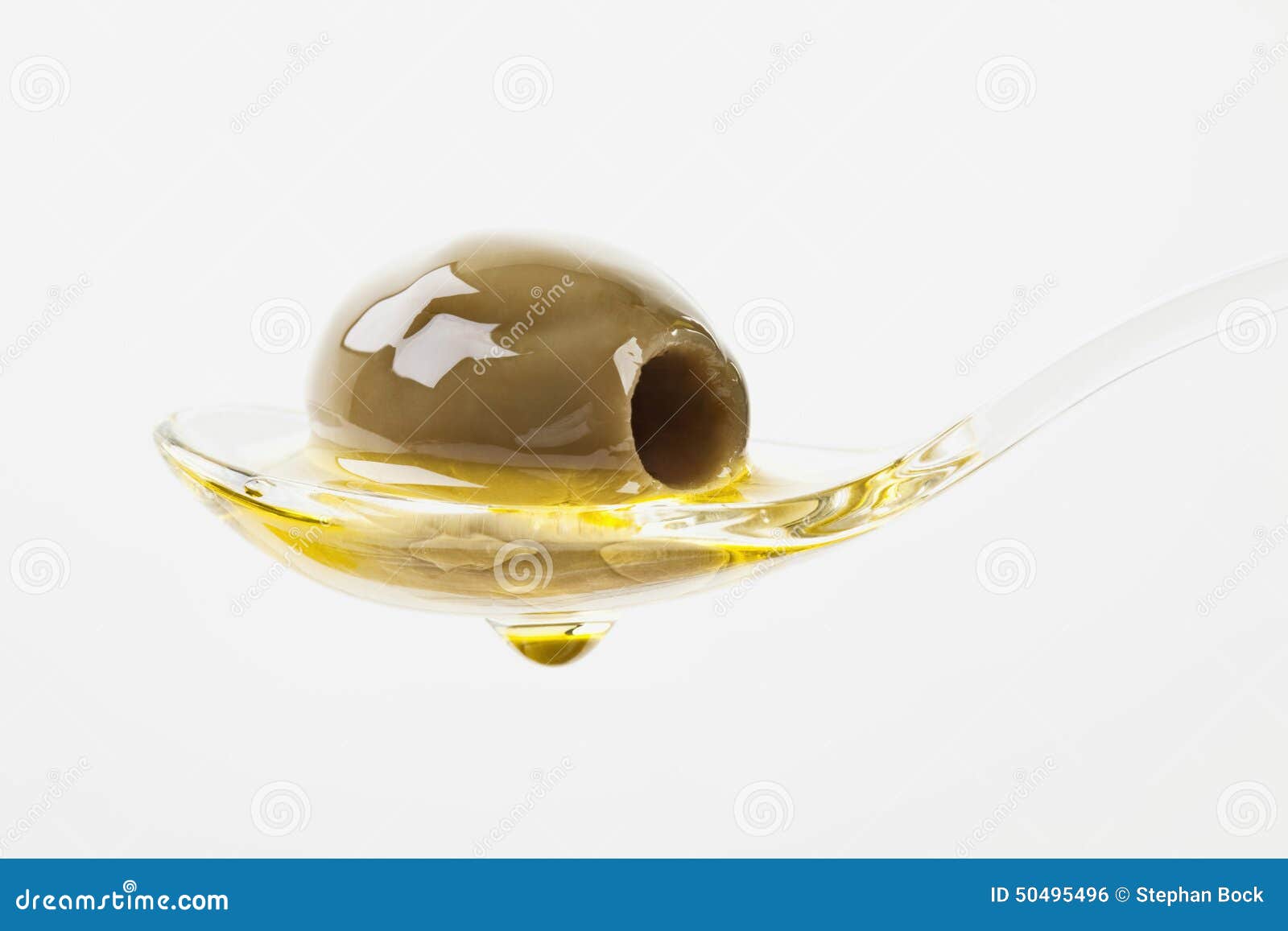 Olive on Spoon with Olive Oil Dropping Down Stock Photo Image of