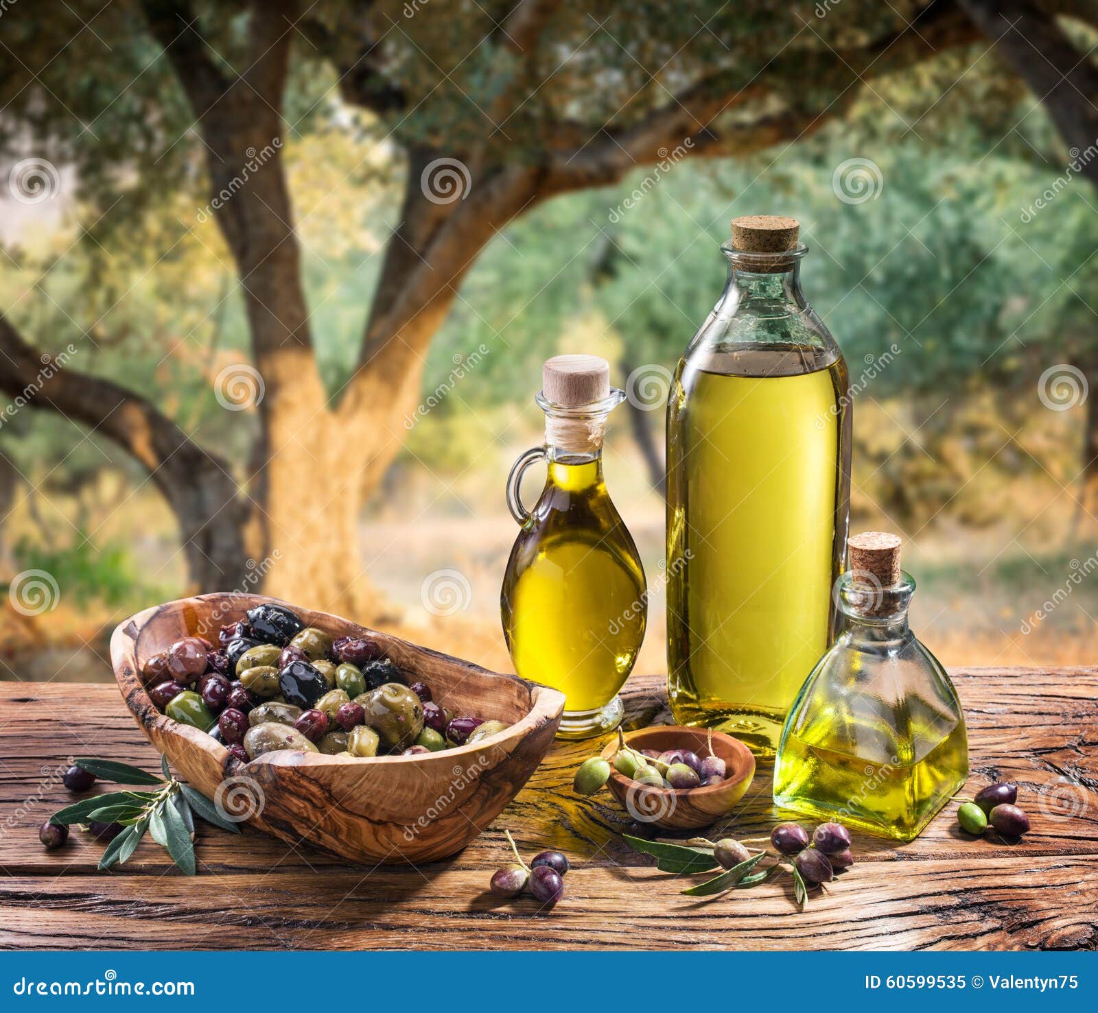 olives and olive oil in a bottle.