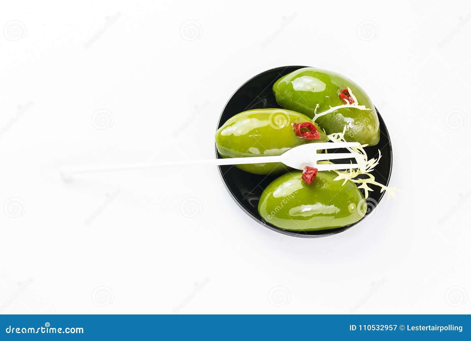 olives in a small plastic plate