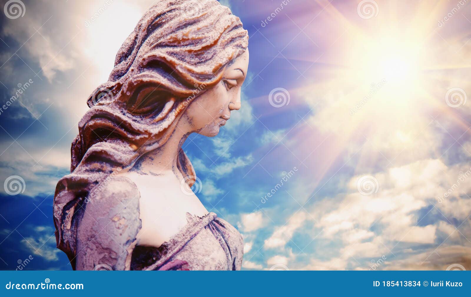 olympic goddess of love and beauty in antique mythology aphrodite venus. ancient statue against dramatic view of sky