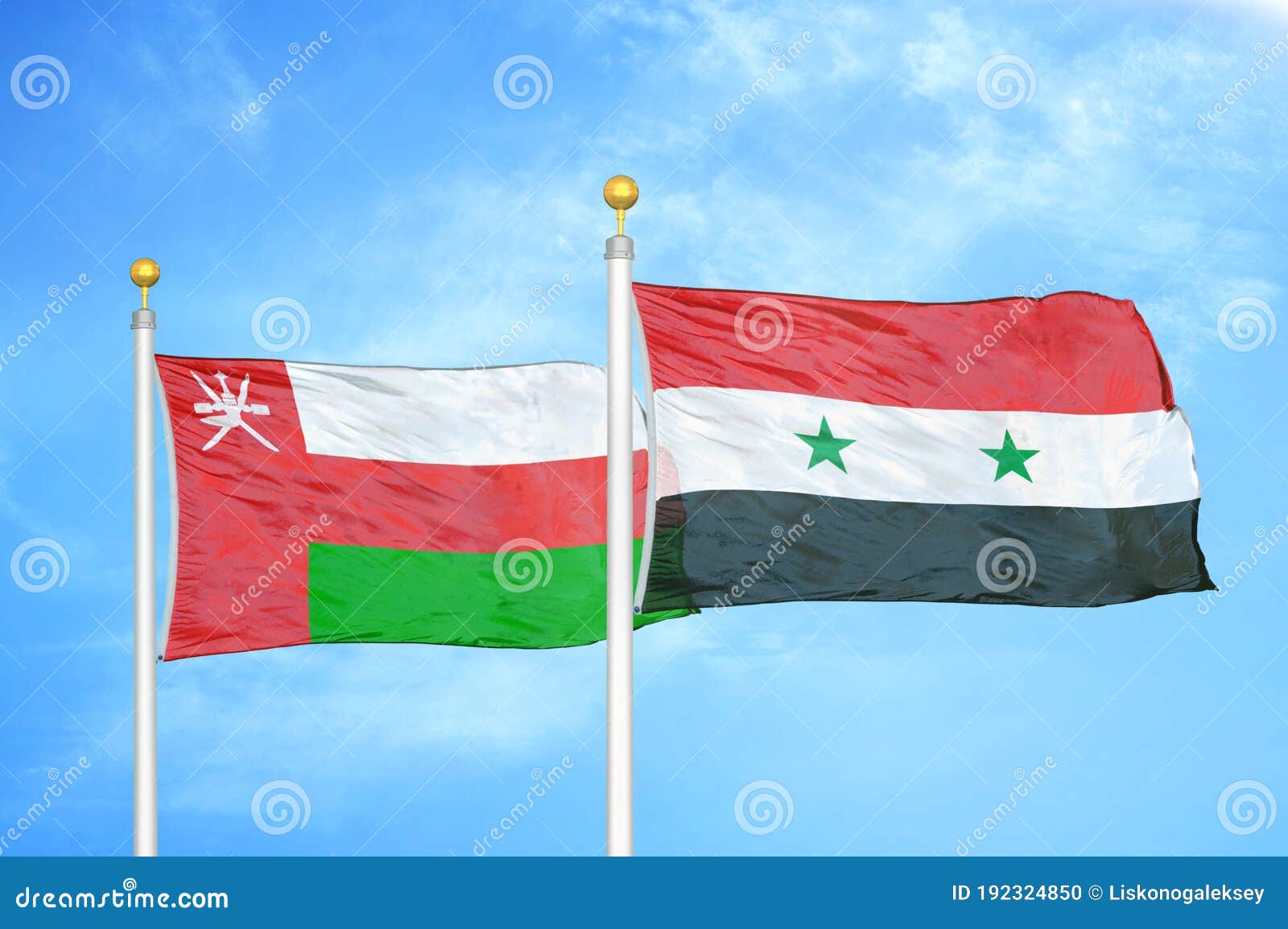 Flag of Syria on a Flagpole Flutters in the Wind Against the Sky