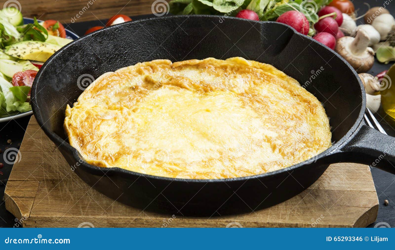 Omelette in a frying pan stock photo. Image of cuisine 65293346