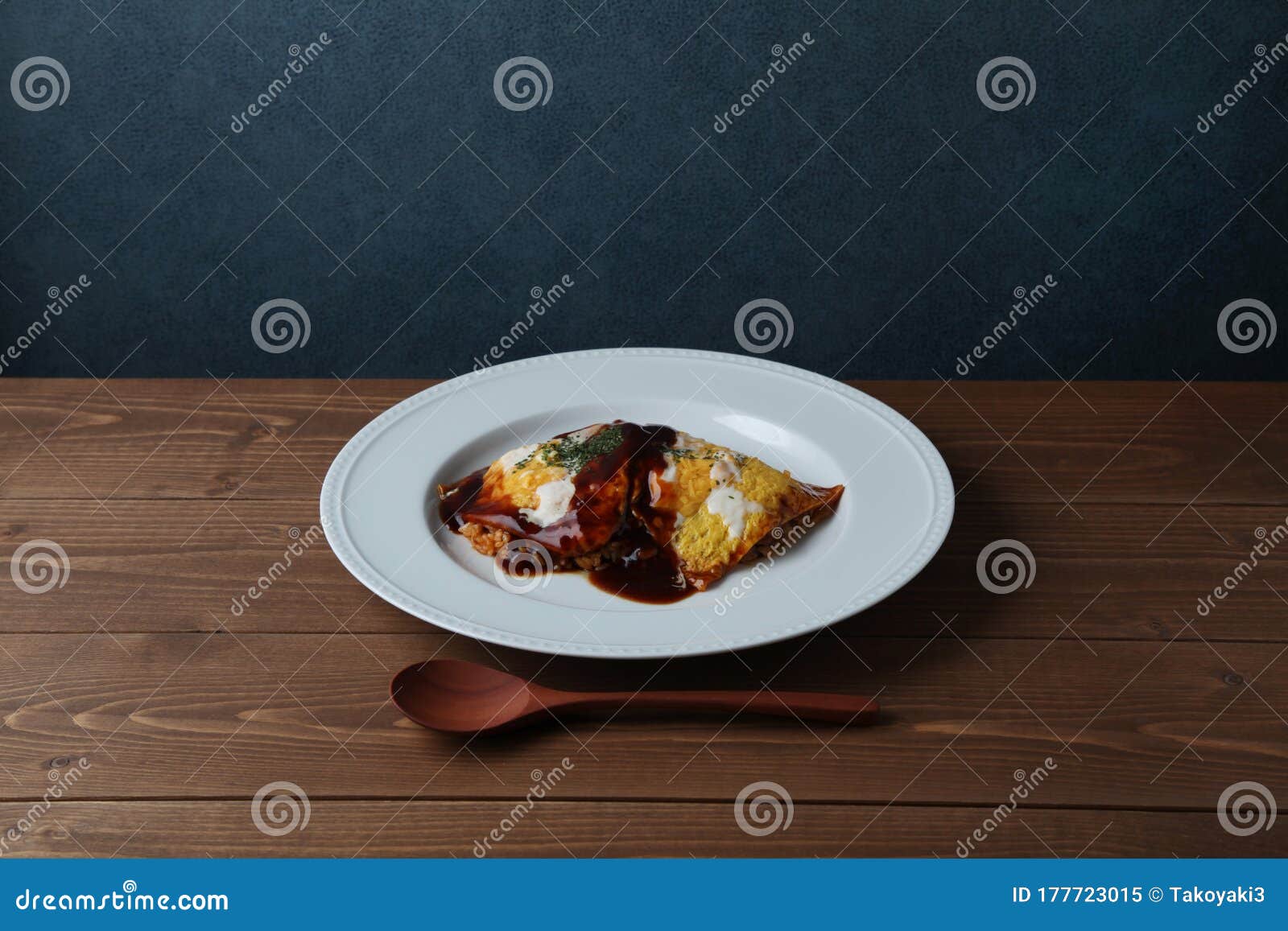 omuraisu omu rice omelet japanese food on plate on table