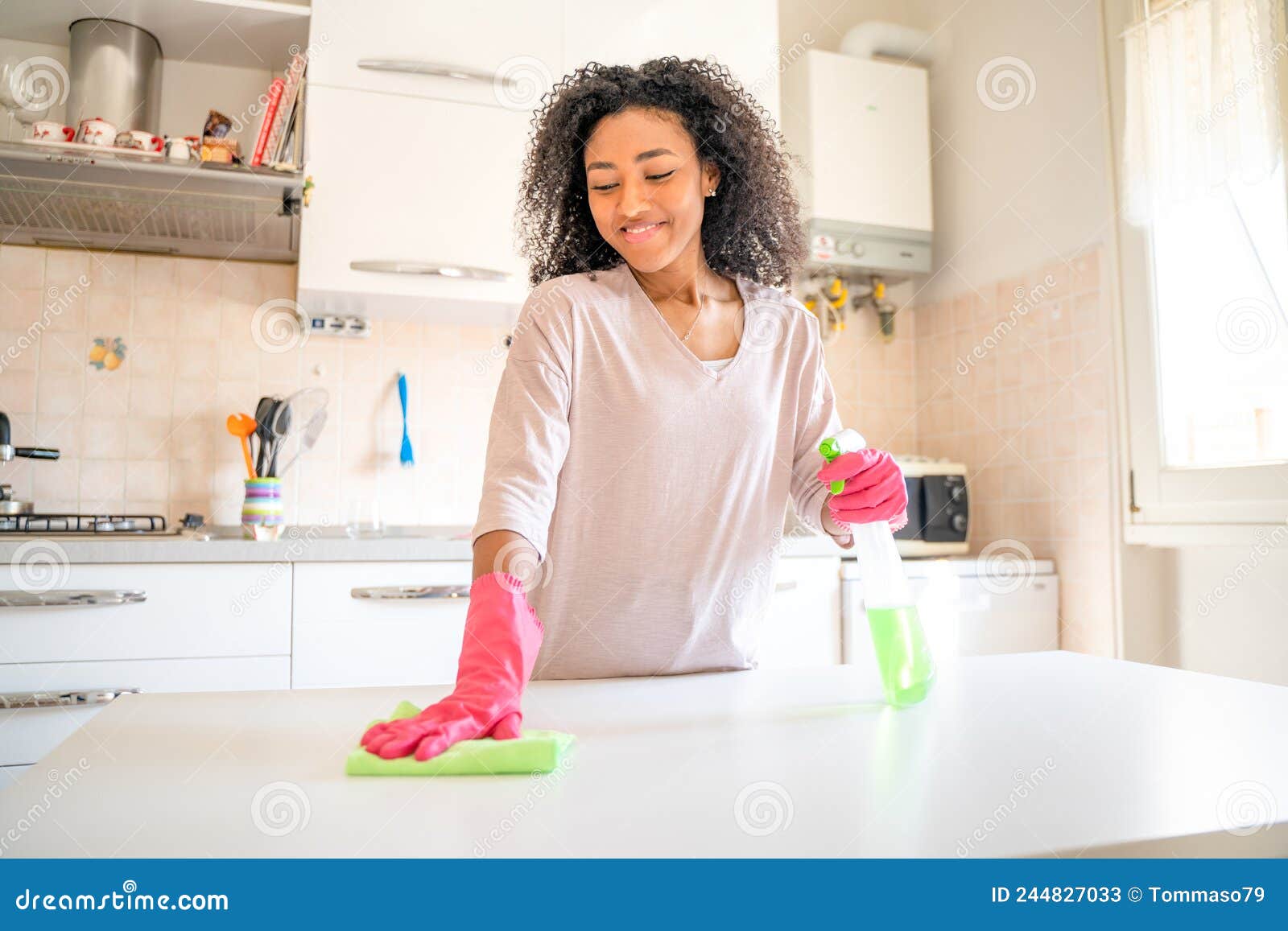 One Black Woman Doing Domestic Housework in the Home Kitchen Stock ...