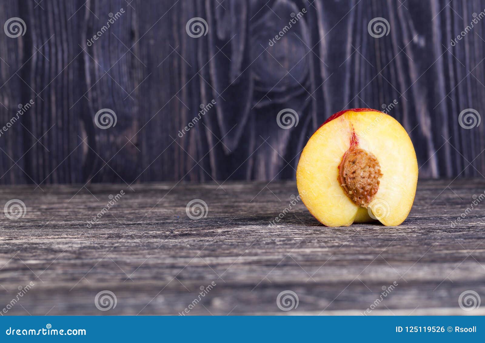 Nectarine, cut into half stock photo. Image of picnic 125119526