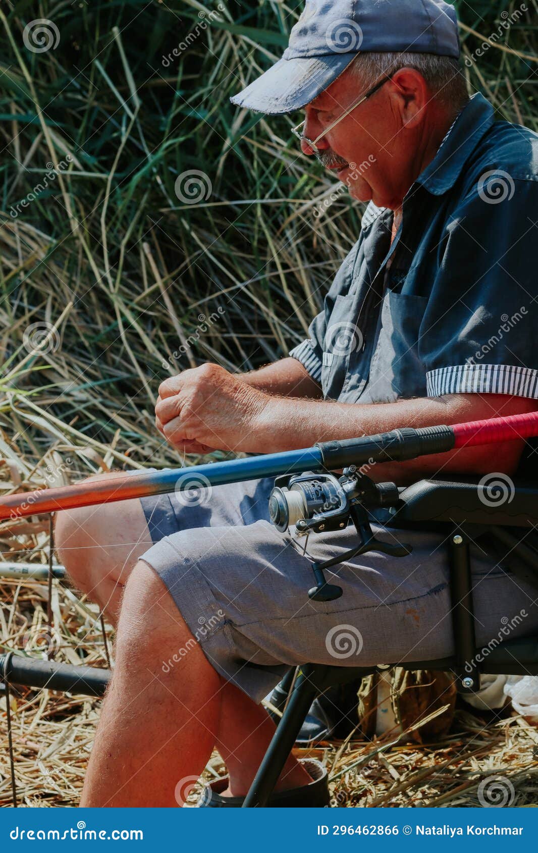 One Man Caught a Fish with a Fishing Rod. Stock Photo - Image of activity,  grandpa: 296462866