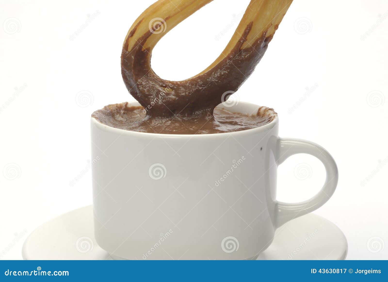 one churro over a cup of chocolate, detail