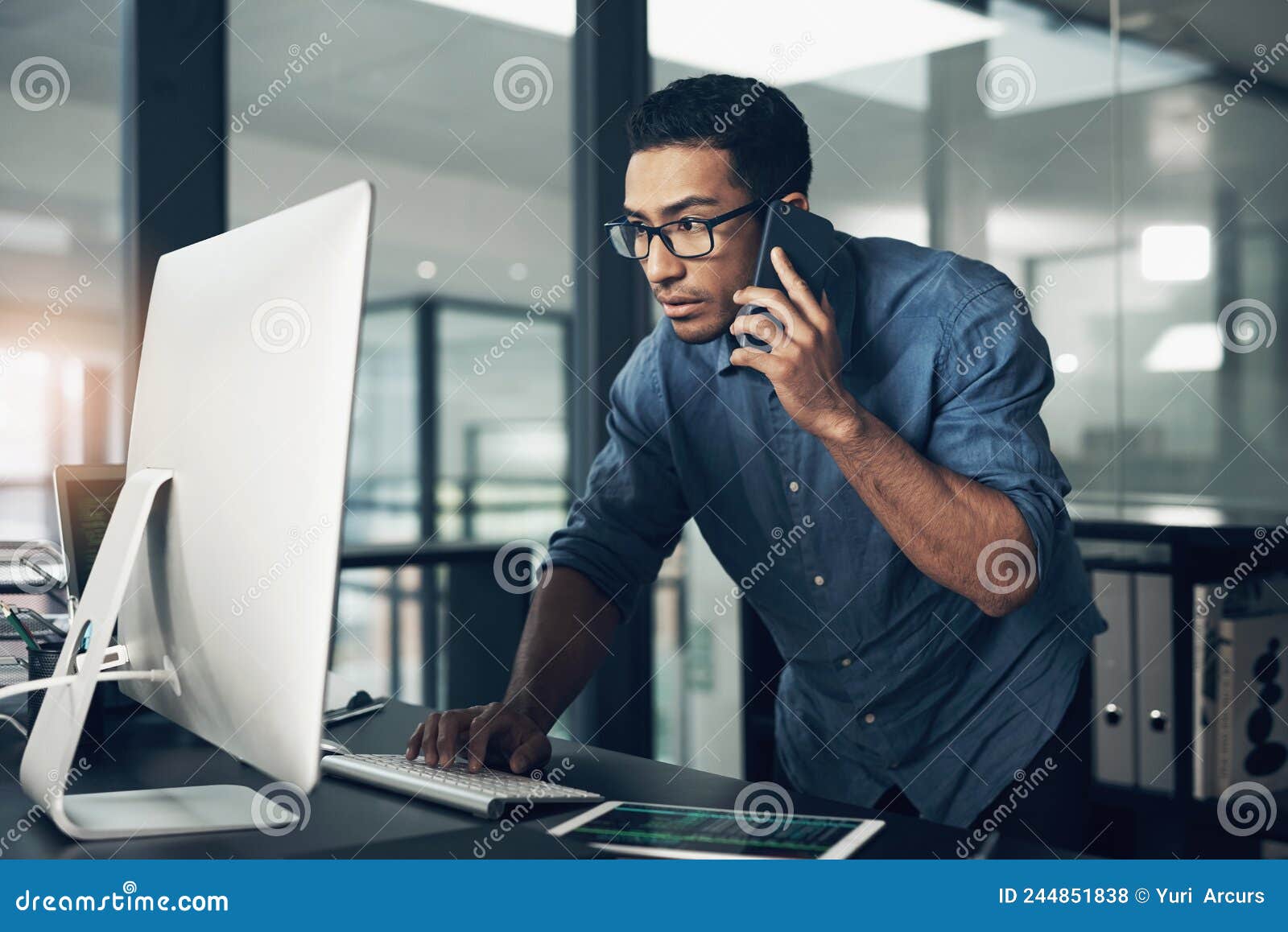 One Decision Away from a Better Tomorrow. Shot of a Young Man Using His