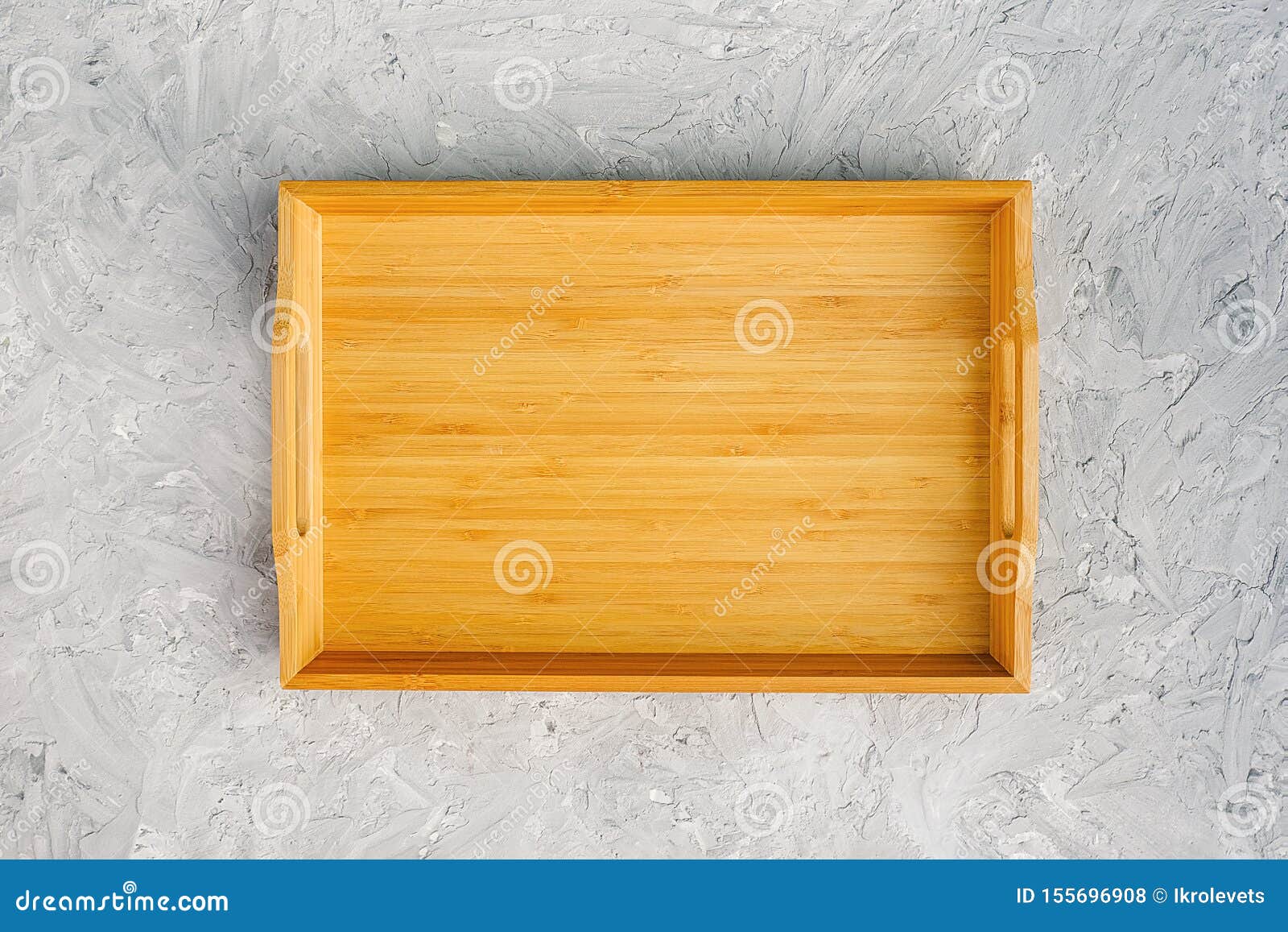 One Empty Wooden Tray on Gray Stone Table. Top View Mock Up Stock Photo