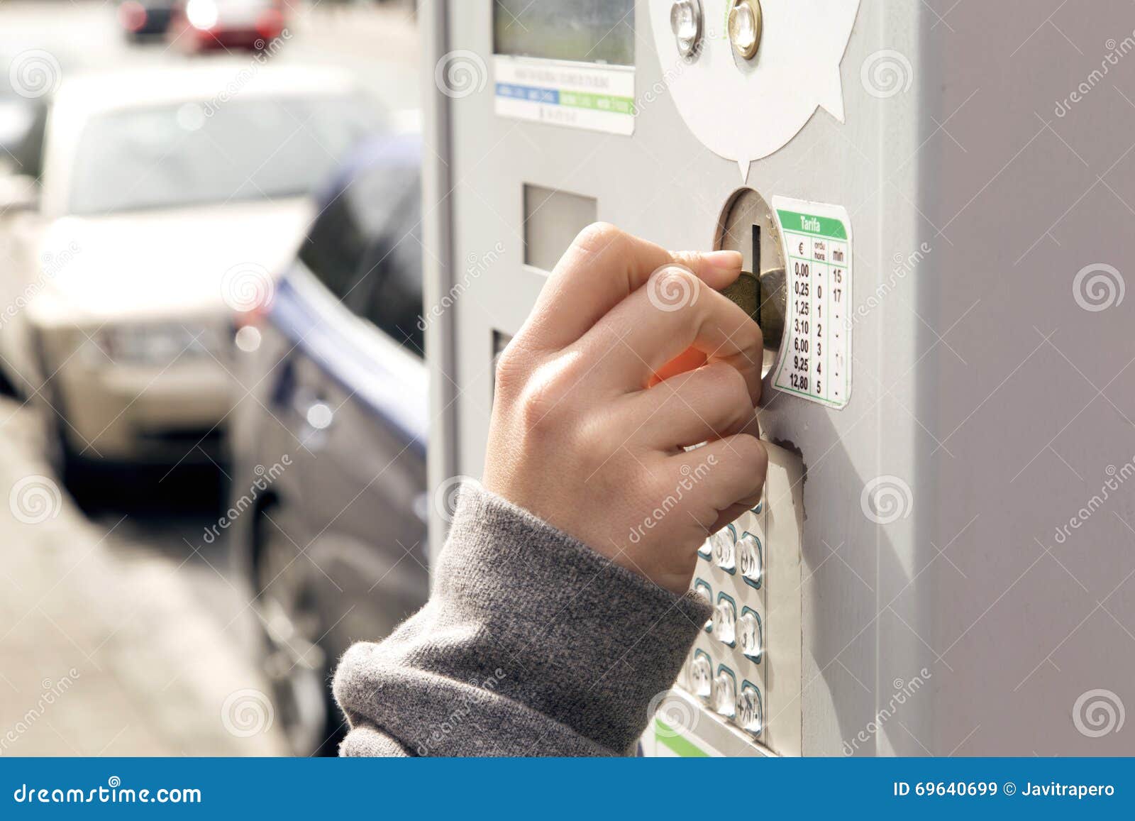 One Hand Inserting a Coin in a Parking Meter. Stock Image Image of
